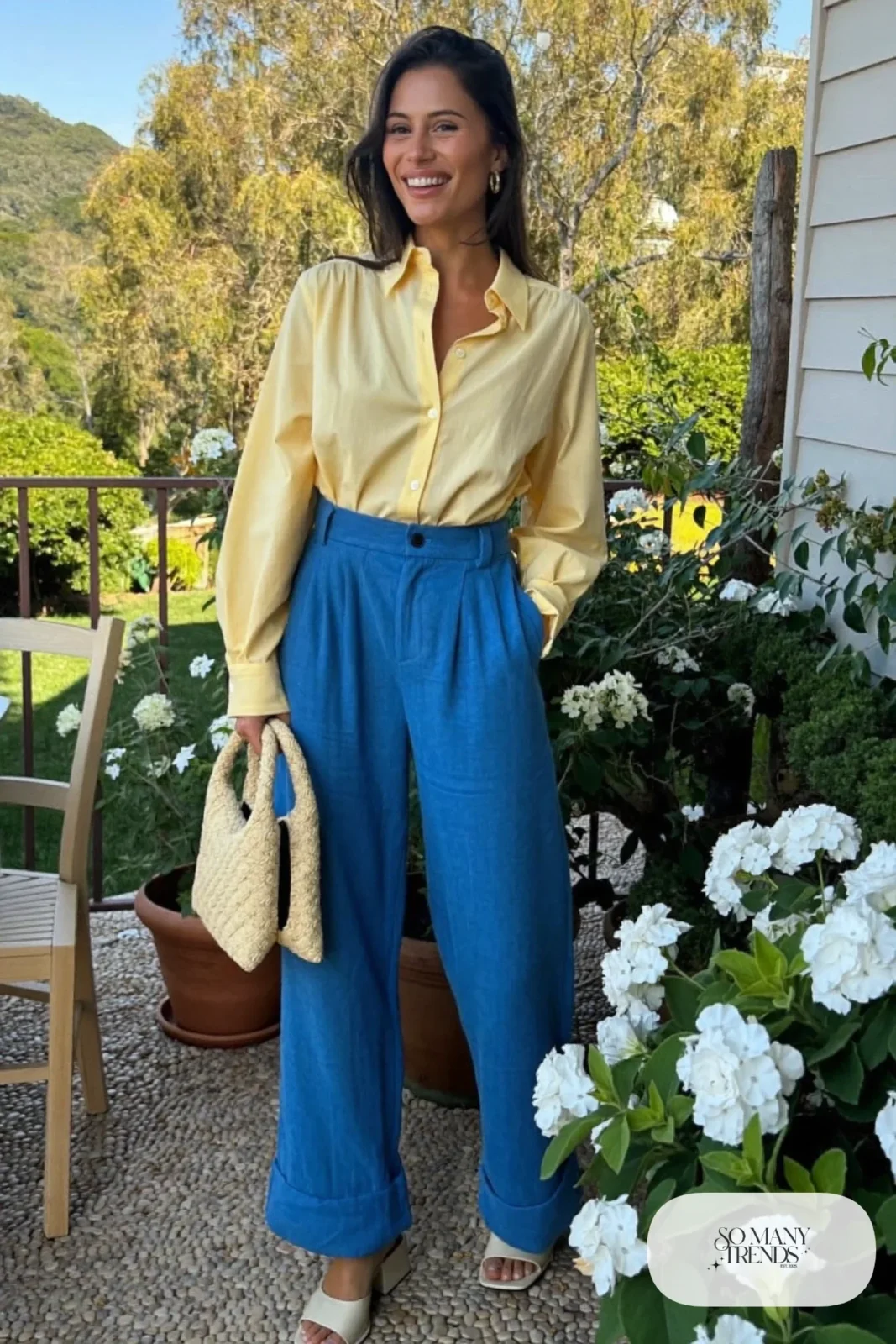 Woman in a butter yellow blouse and cobalt blue wide-leg linen pants with cream block-heel sandals, garden party outfit 23