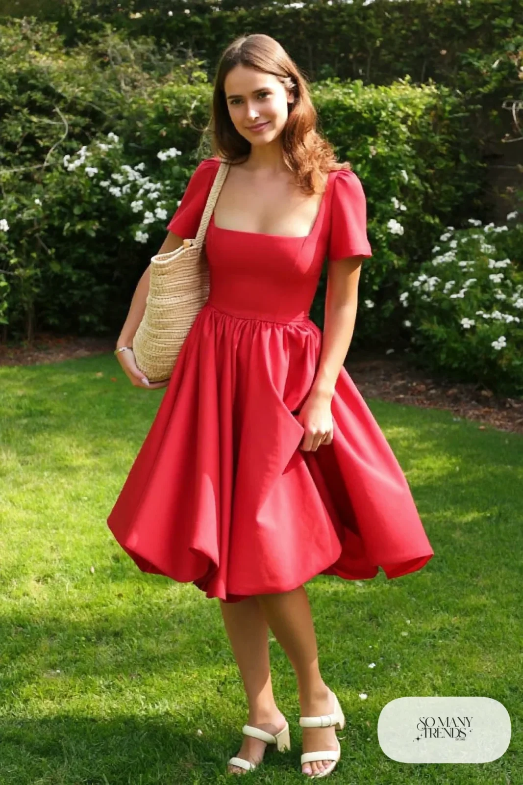 Woman in a true red crepe midi dress with full skirt and cream block-heel sandals, garden party outfit 25