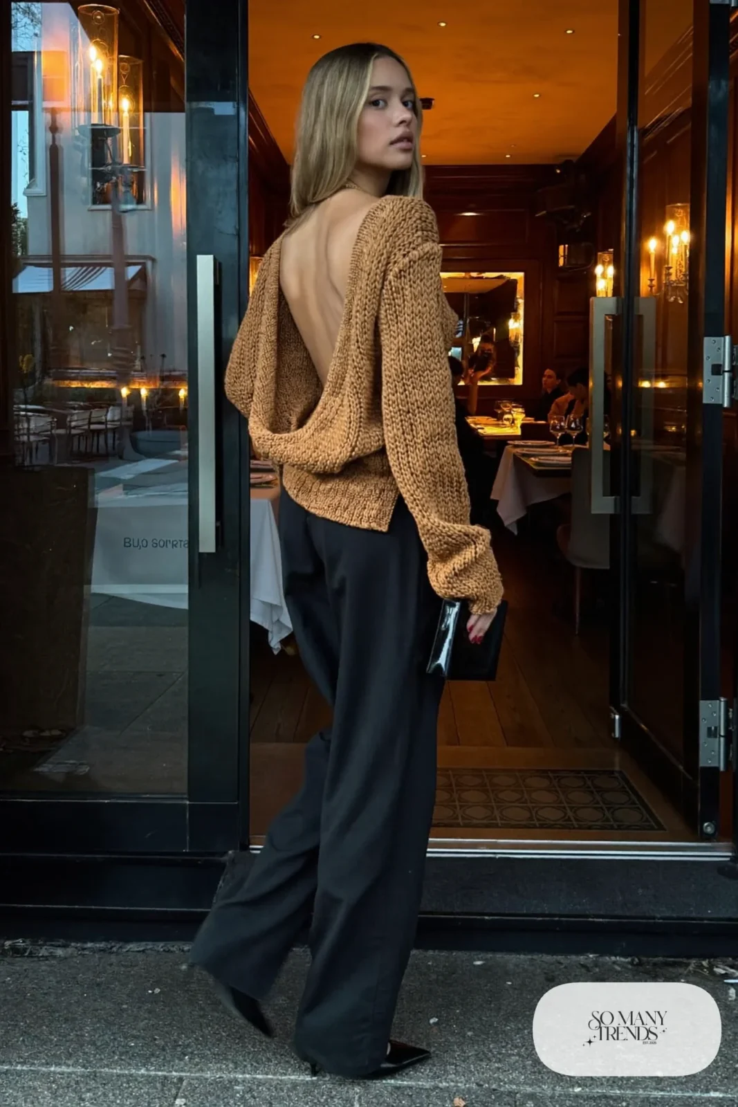 Look 3: caramel backless knit top, wide-leg black pants, black pointed heels, small black bag