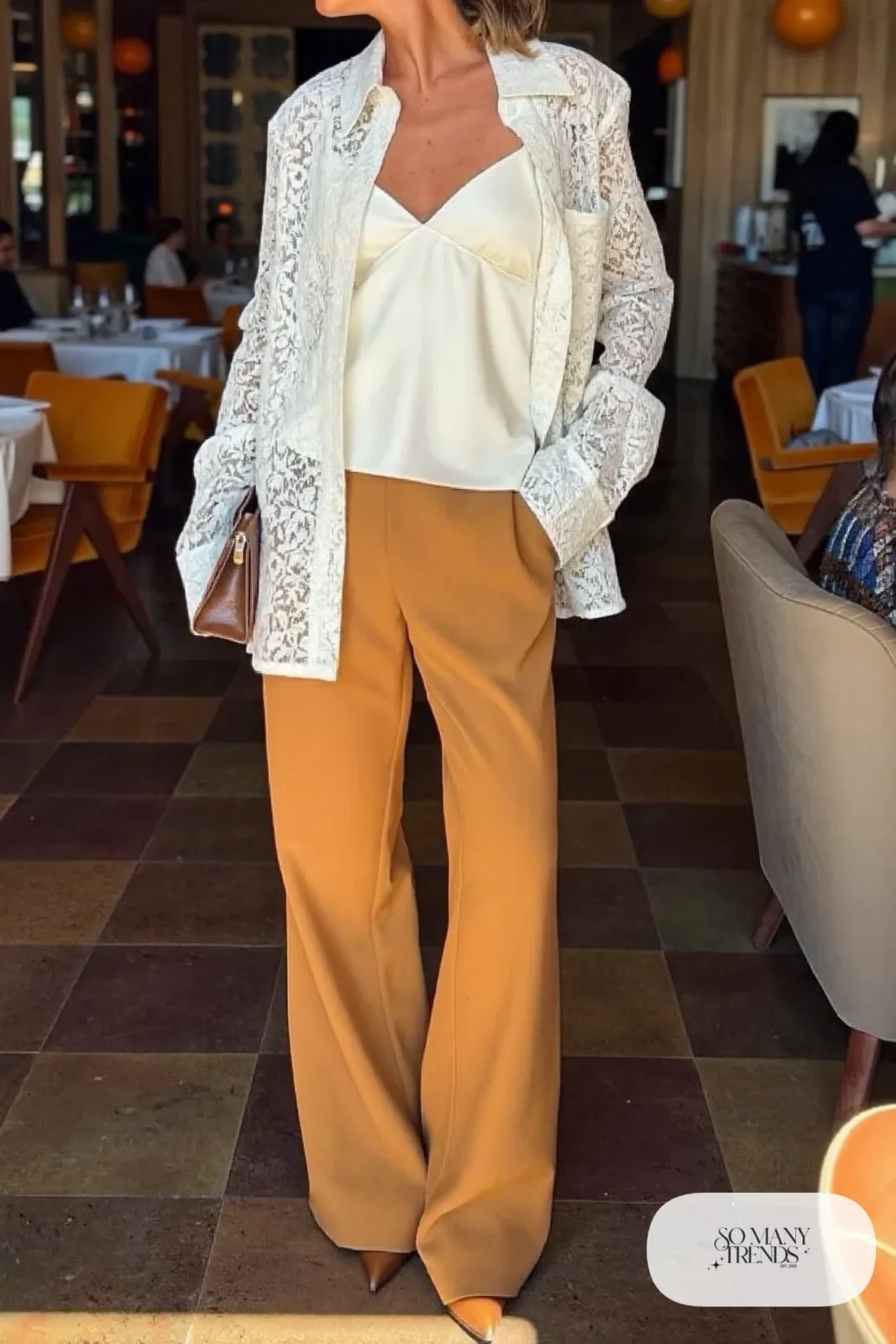 Look 15: ivory lace shirt over a camisole, caramel straight-leg tailored pants, brown pointed heels, small clutch