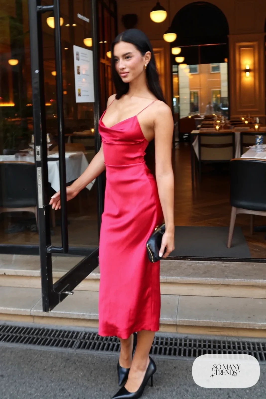 Look 25: red satin slip dress, black heeled ankle boots, small clutch