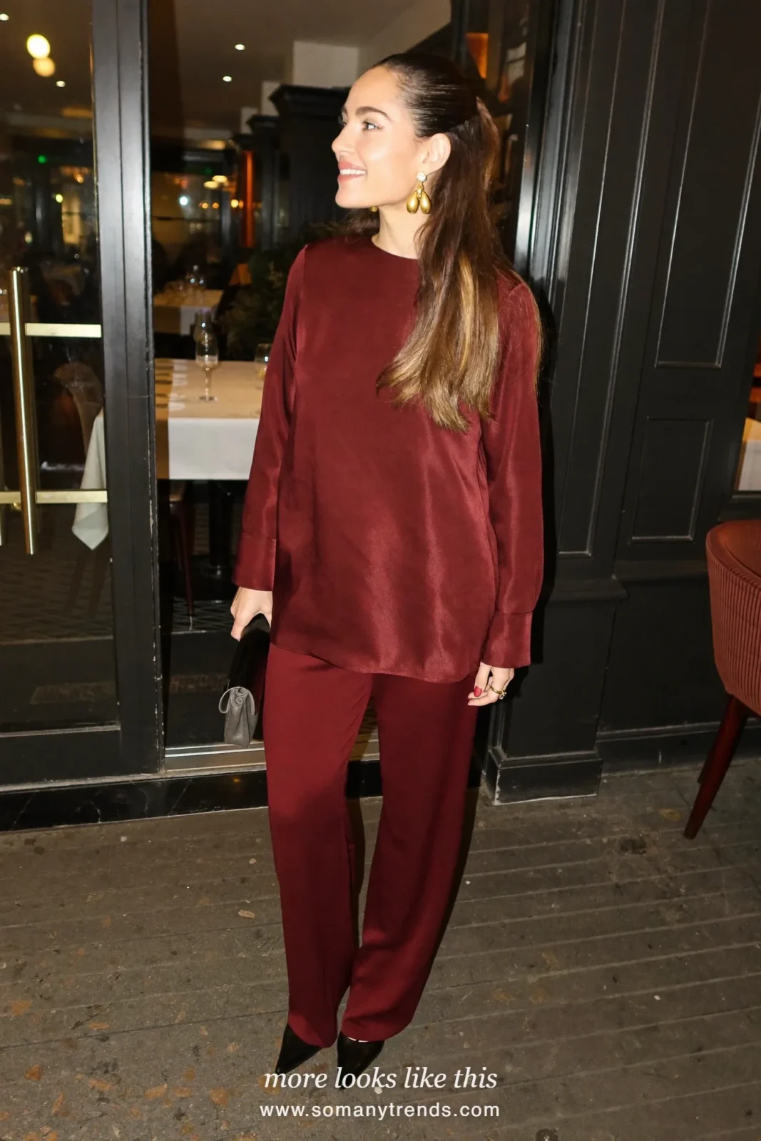 Burgundy silk top with burgundy crepe pants, gold earrings and black heels, outfit 6