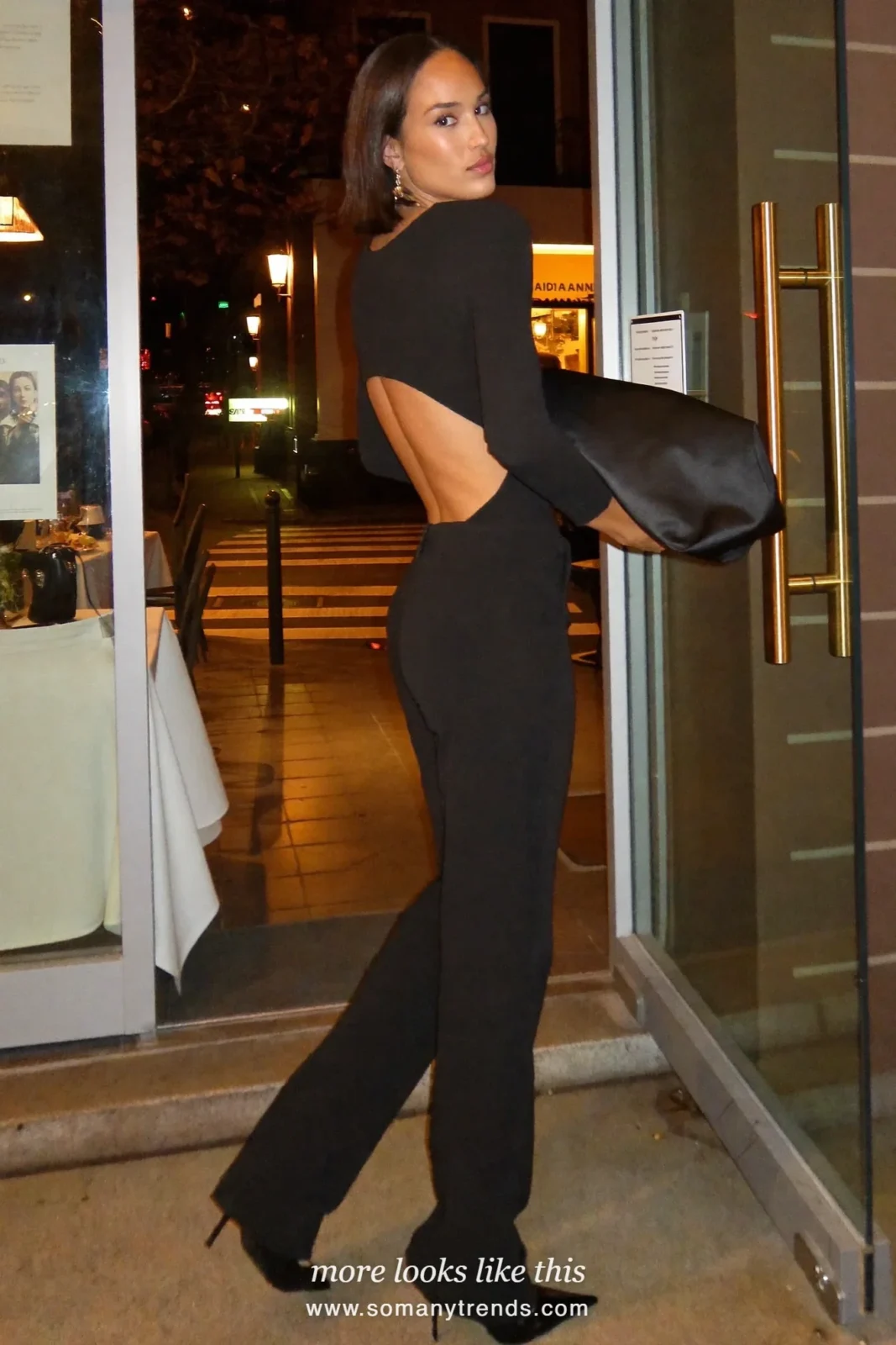 Black open-back top with wide black pants, drop earrings and heels, outfit 13
