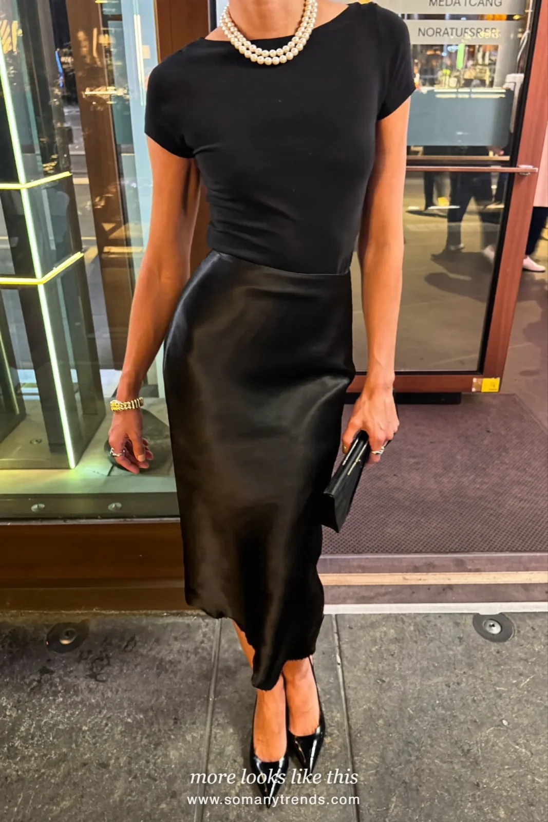 Black satin midi skirt with fitted black knit, pearl necklace and heels, outfit 21