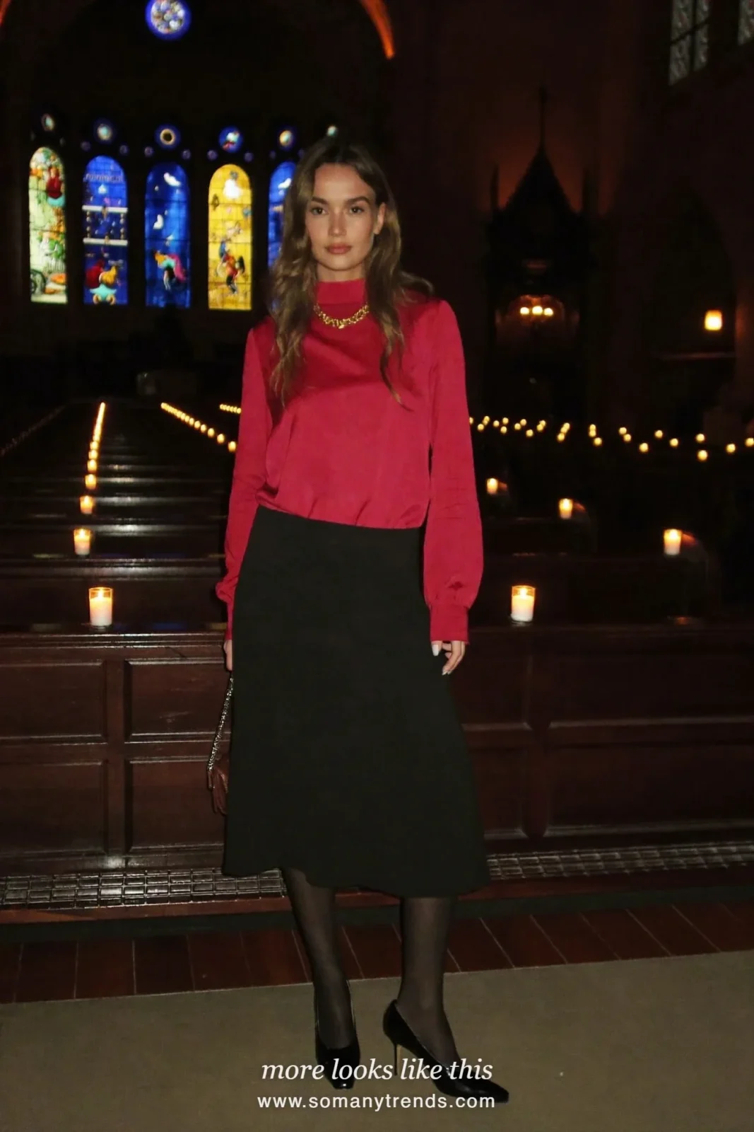 Woman in a red velvet-trim blouse, long black skirt, gold chain and black heels, church outfit 9