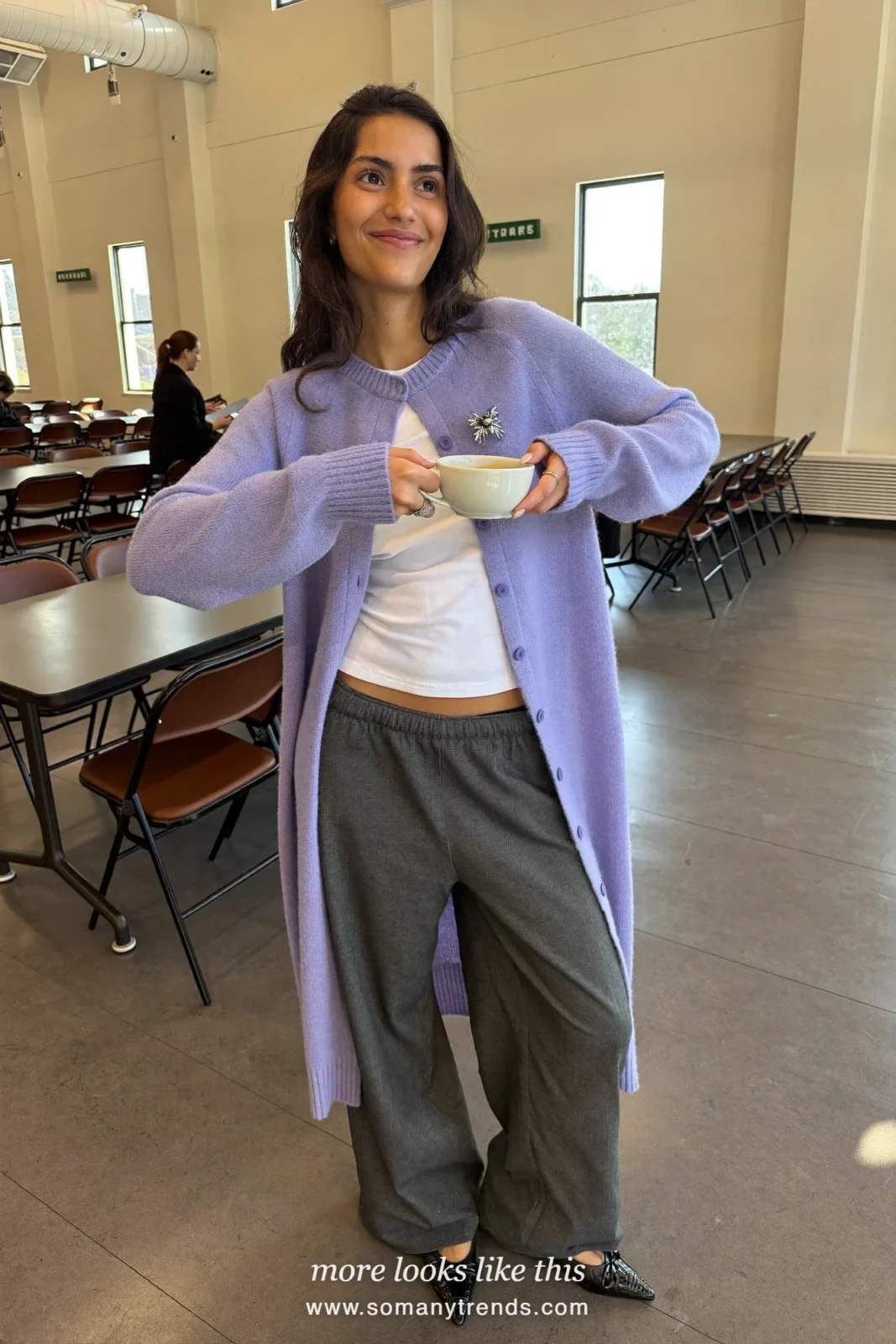 Woman in a lavender cardigan, charcoal wide pants, silver brooch and flats, church outfit 17