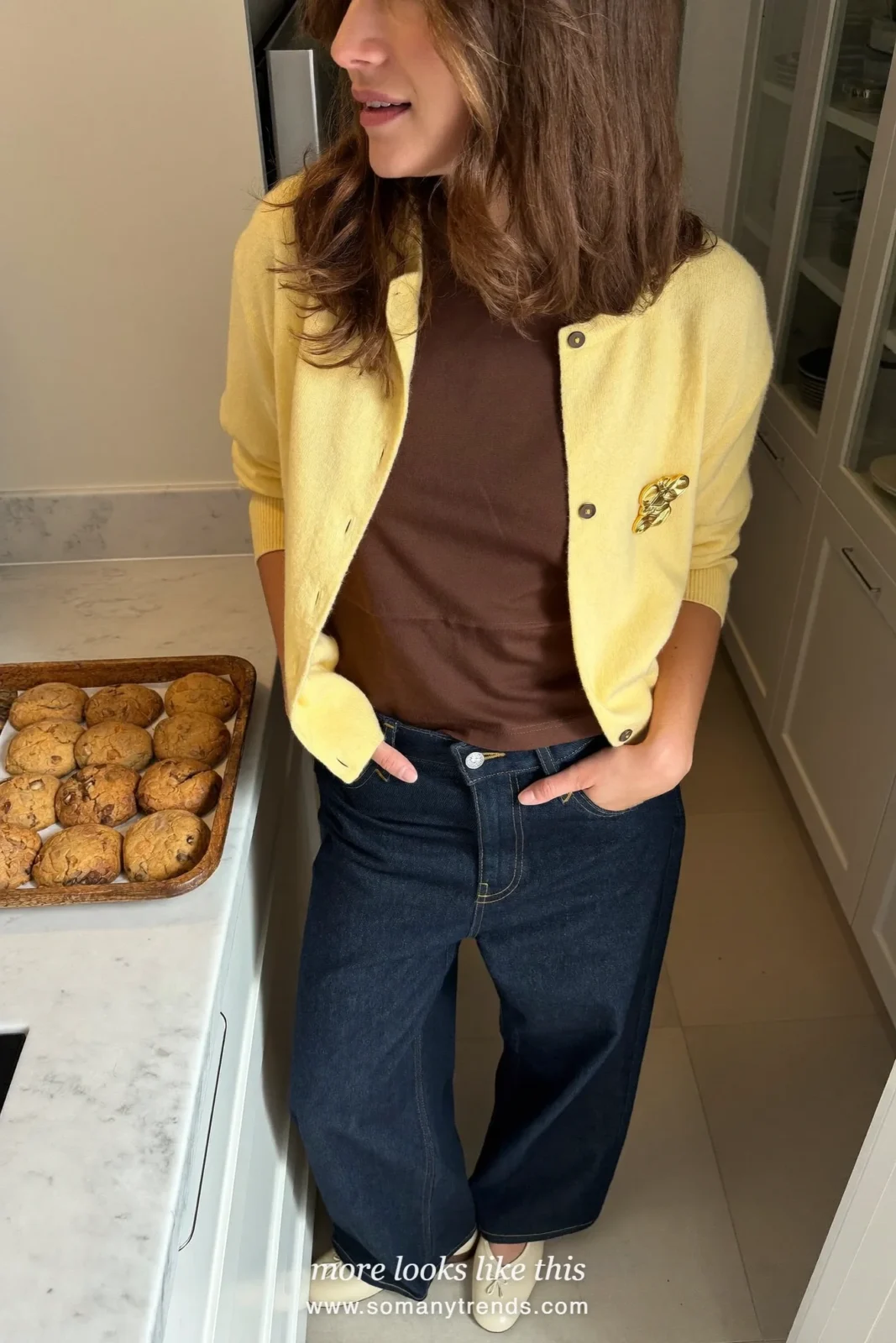 Butter yellow cardigan with a gold brooch over a chocolate tee and dark jeans, Christmas outfit 7