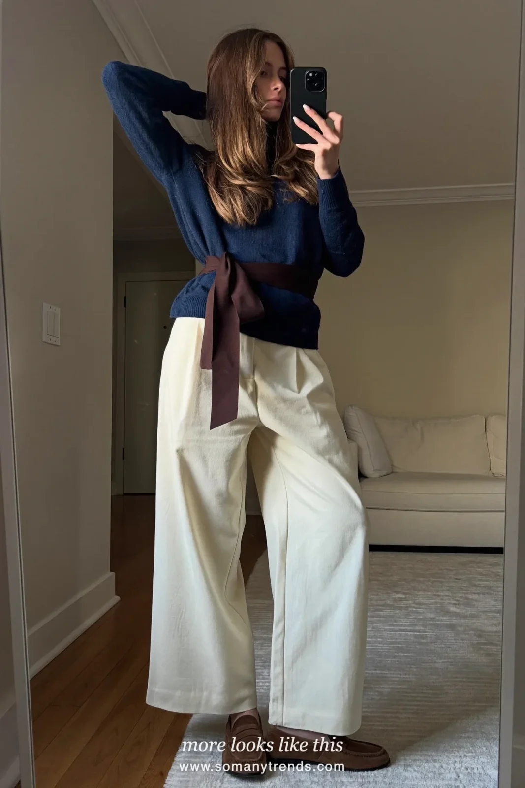 Soft navy knit sweater with a chocolate ribbon belt and ecru wide pants with flats, Christmas outfit 8