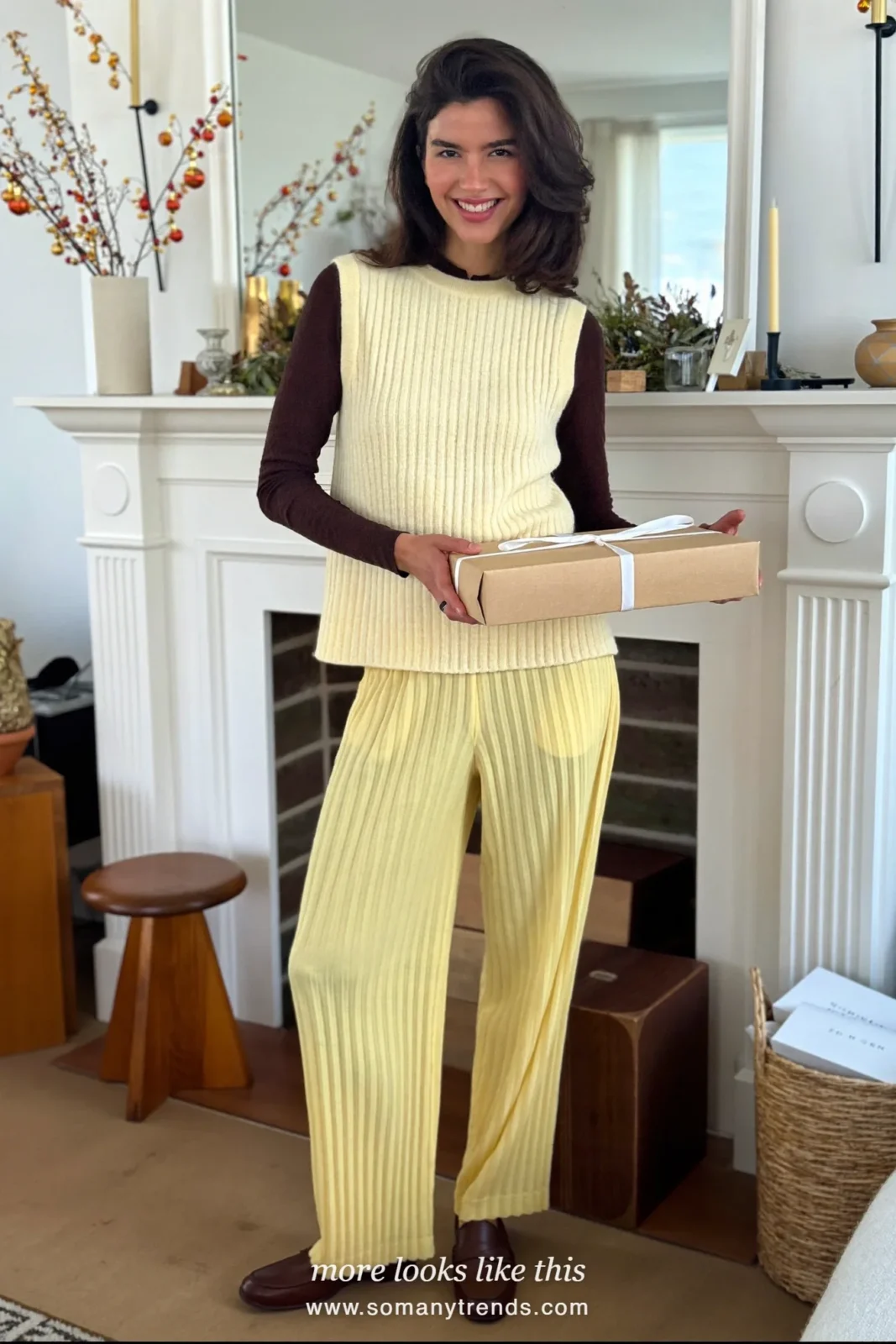 Ecru knit vest over a chocolate long sleeve top with butter yellow pleated pants, Christmas outfit 10