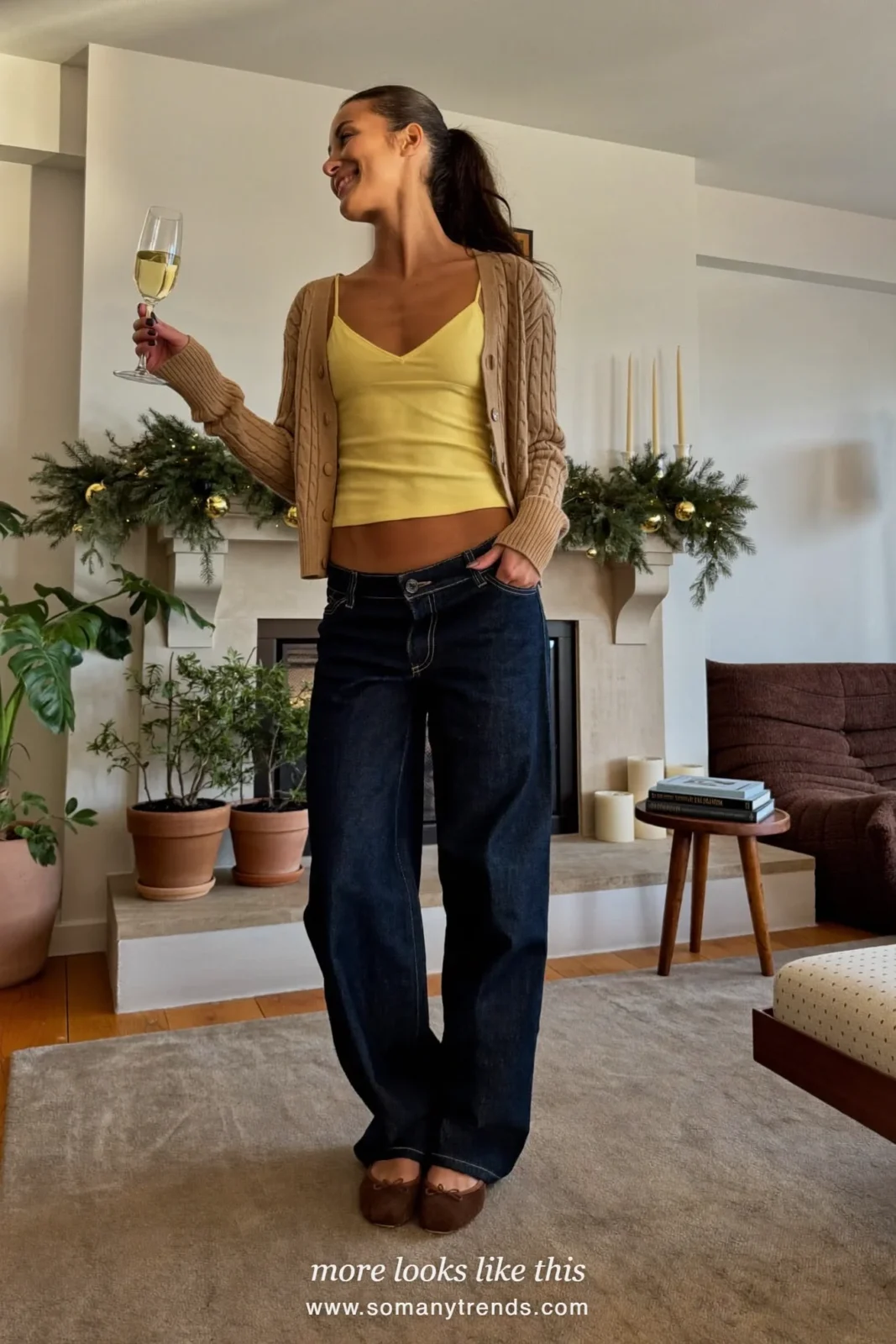 Camel cardigan over a butter yellow cami with wide dark jeans and flats, Christmas outfit 23