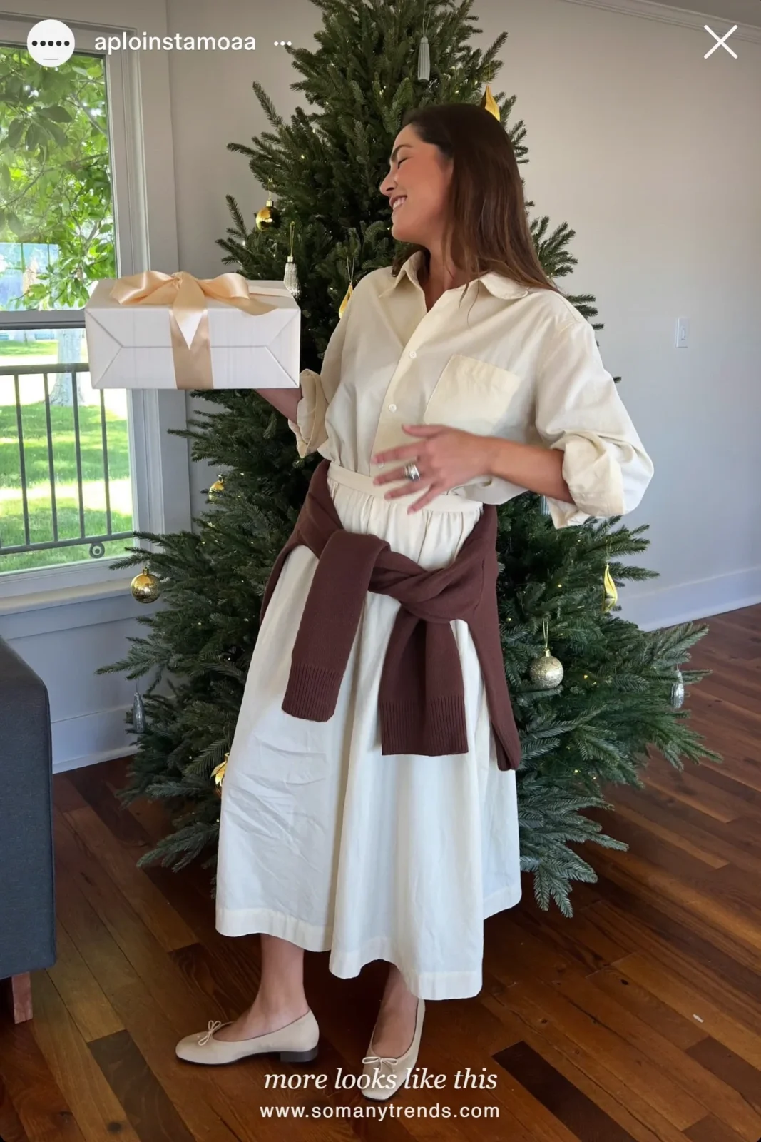 Cream shirt dress with a chocolate sweater tied at the waist and ballet flats, Christmas outfit 26