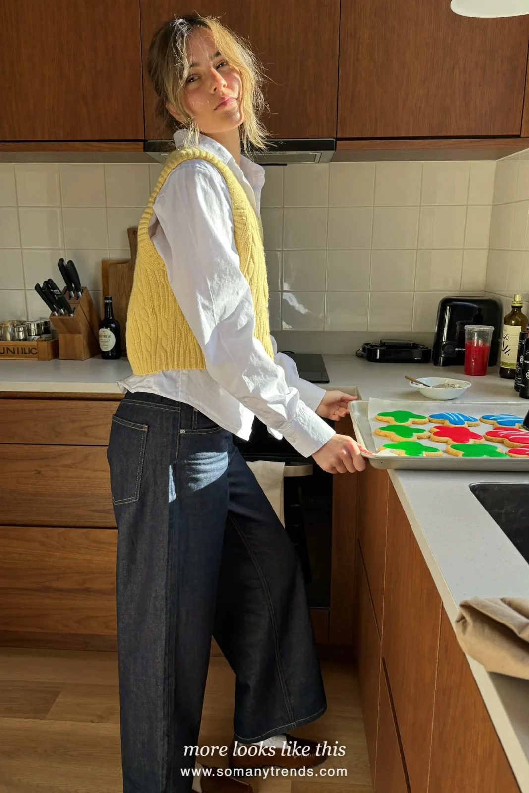 Butter yellow knit vest over a white shirt with straight dark jeans and loafers, Christmas outfit 27