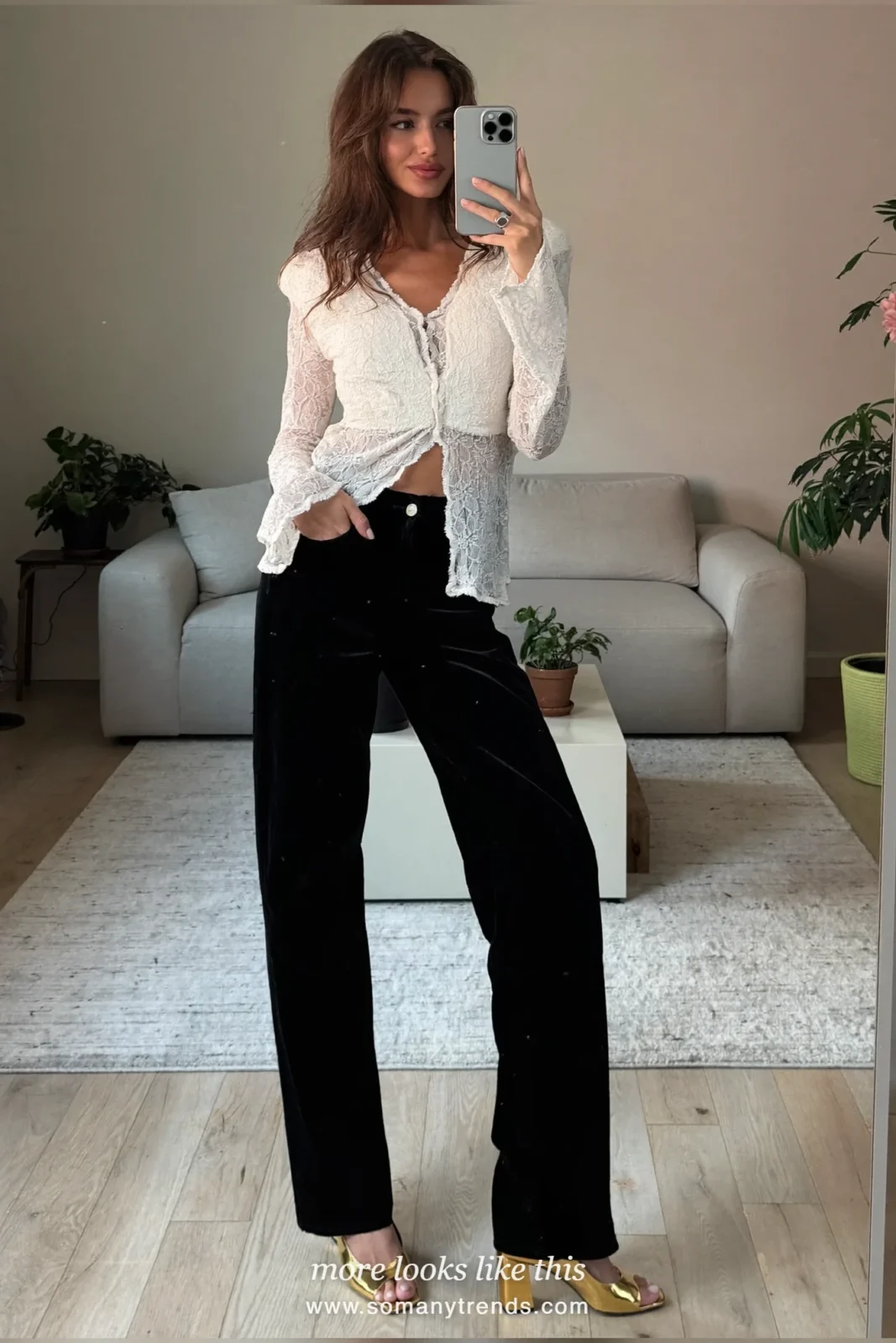 Woman in a white lace top, black velvet wide-leg pants and gold heels, outfit 8