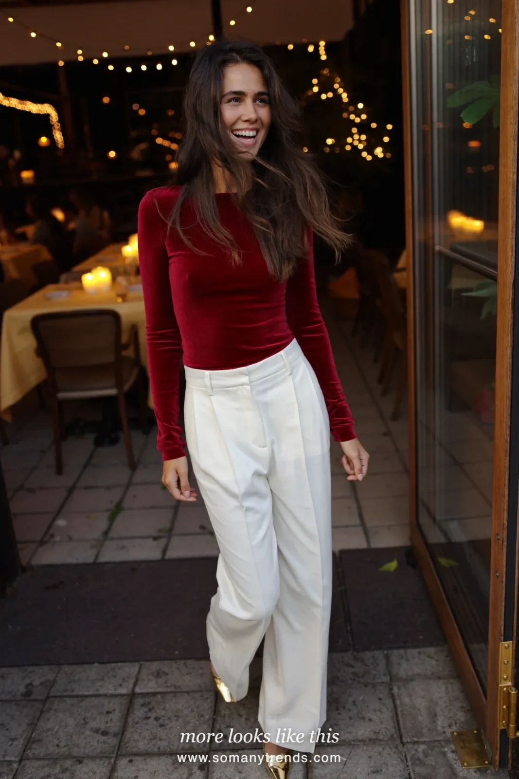 Woman in a red velvet long-sleeve top, white wide-leg pants and gold heels, outfit 23