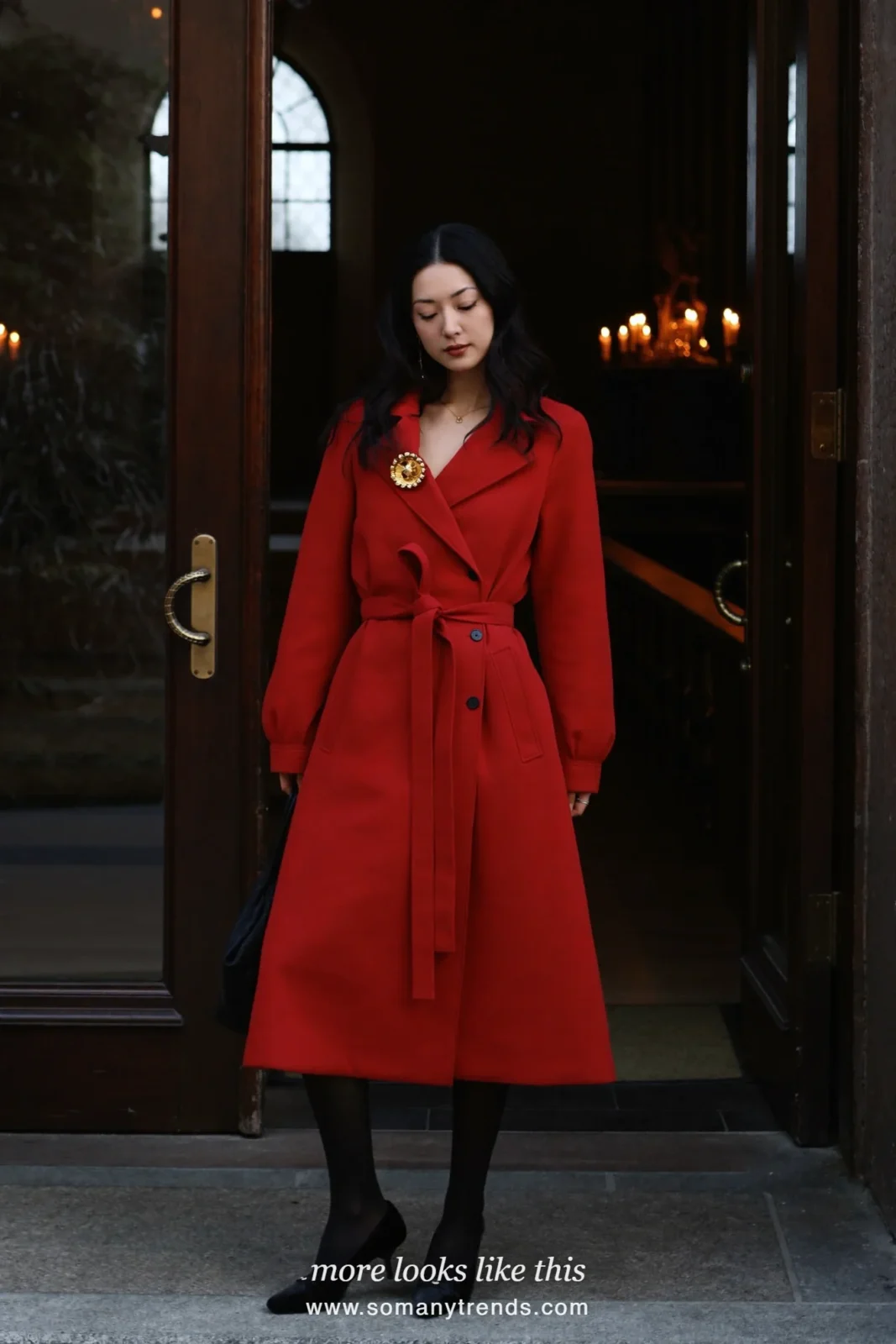 Woman in a deep red belted coat dress, gold brooch and black pumps, church outfit 11