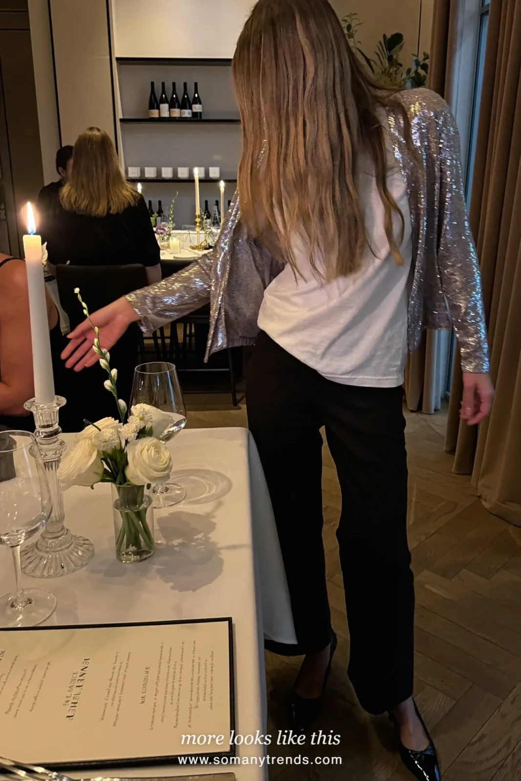 Woman in a sequin cardigan over a white tee with black wide-leg pants and black pumps, outfit 27
