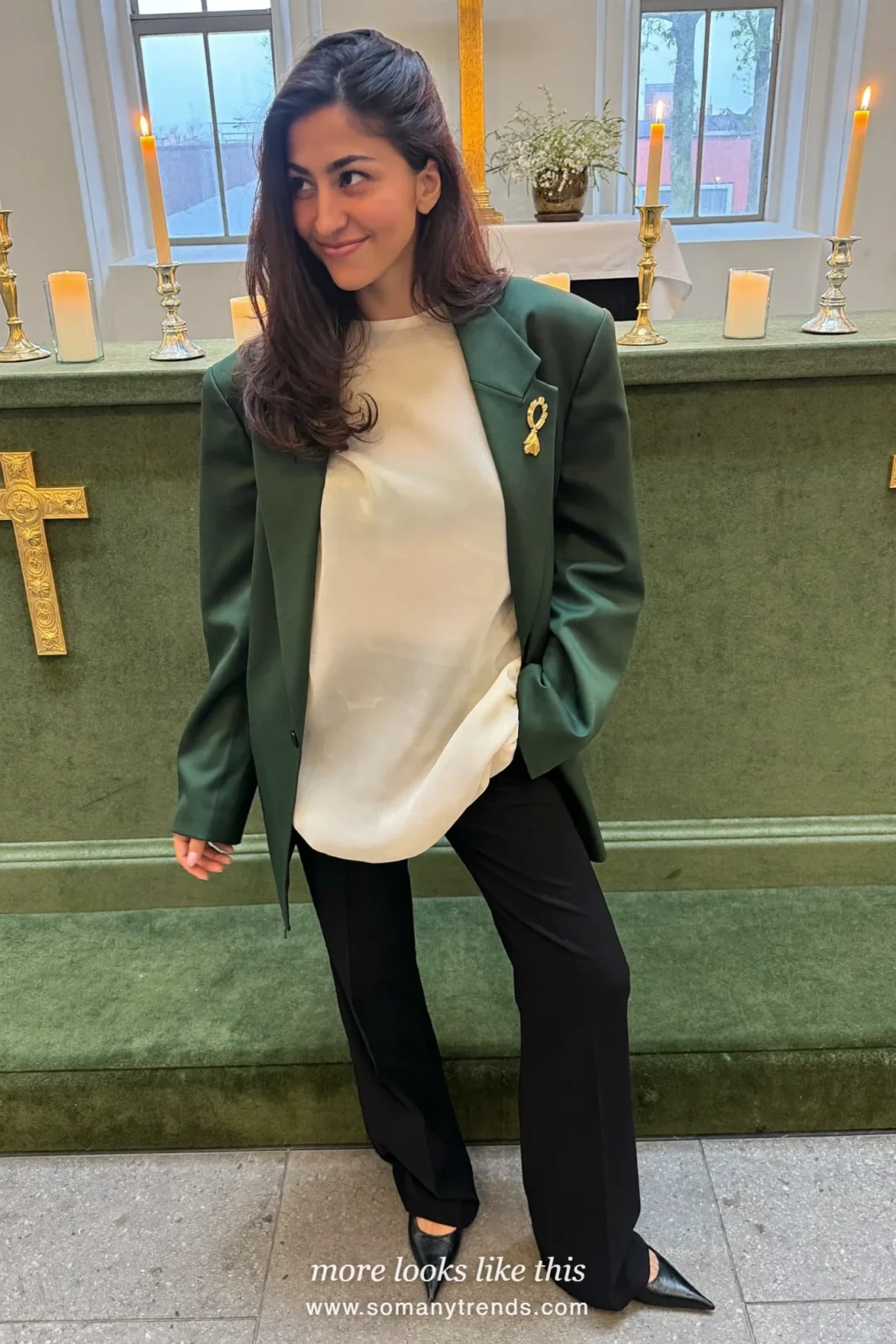 Woman in a forest green long blazer, cream shell, black wide pants and pumps, church outfit 15