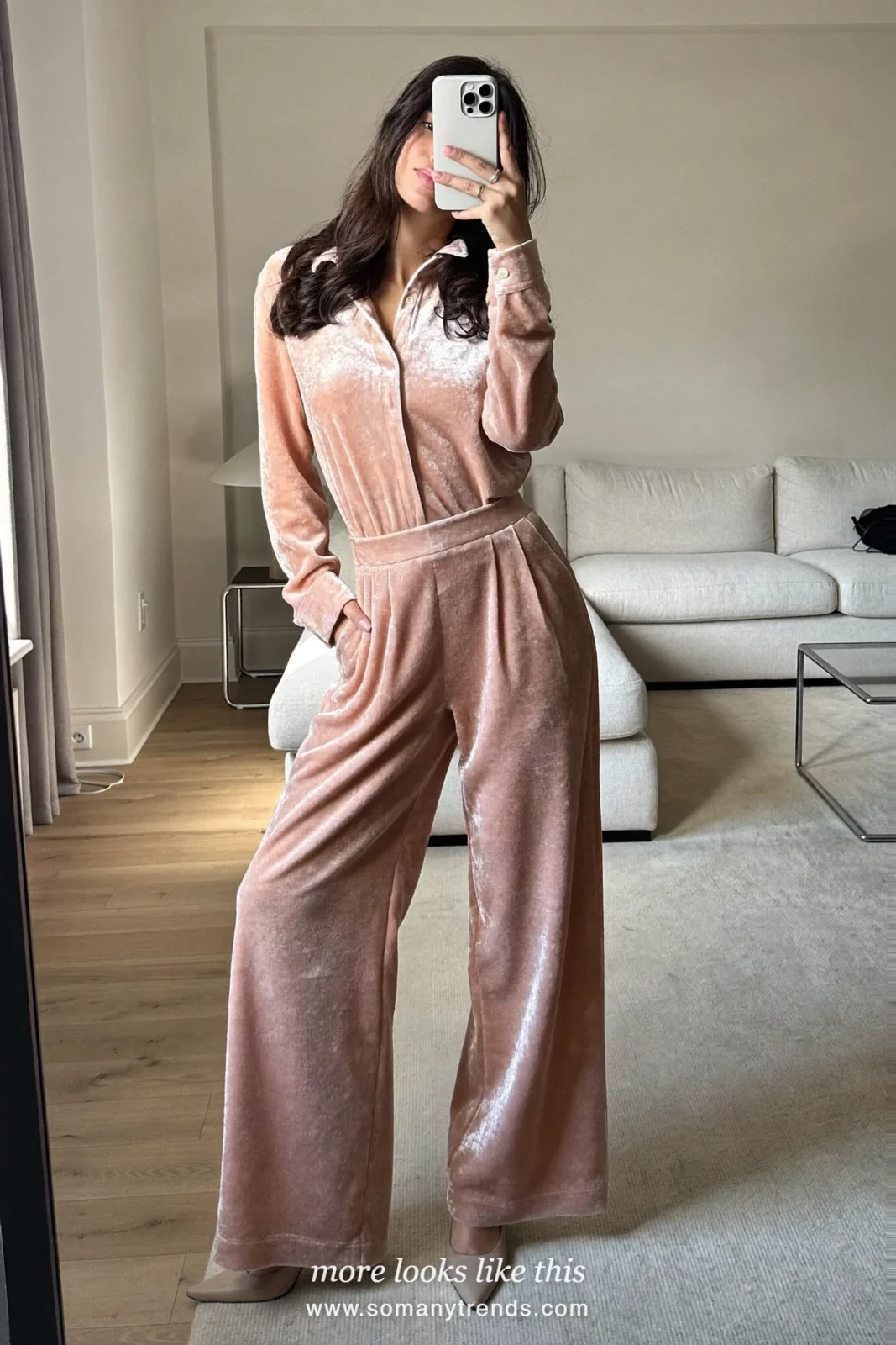Woman in a blush pink velvet wide-leg jumpsuit with gold earrings and nude pumps, outfit 28