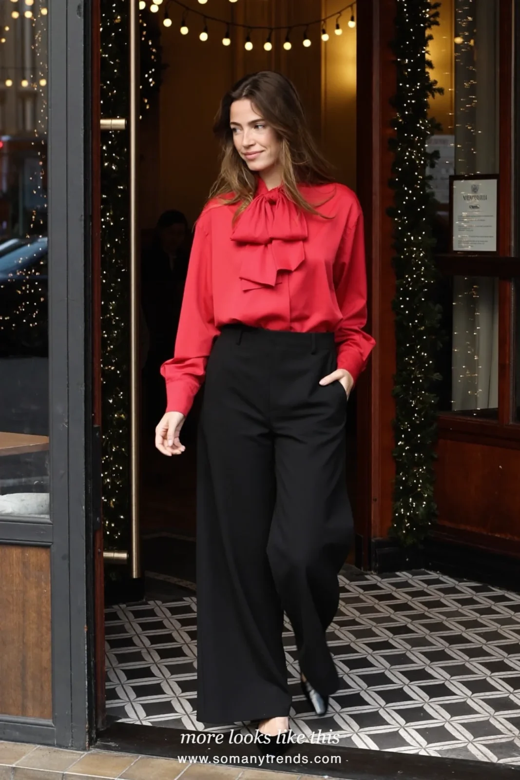 Woman in a cherry red bow-neck blouse, black tailored wide-leg pants and black pumps, outfit 29