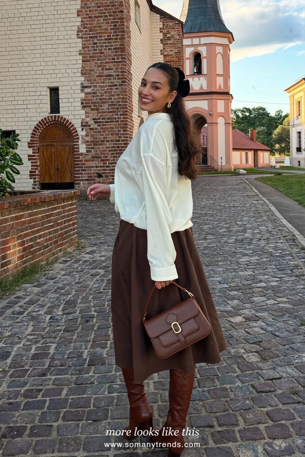 Woman in a chocolate brown midi skirt, ivory blouse, velvet hair bow and brown boots, church outfit 22