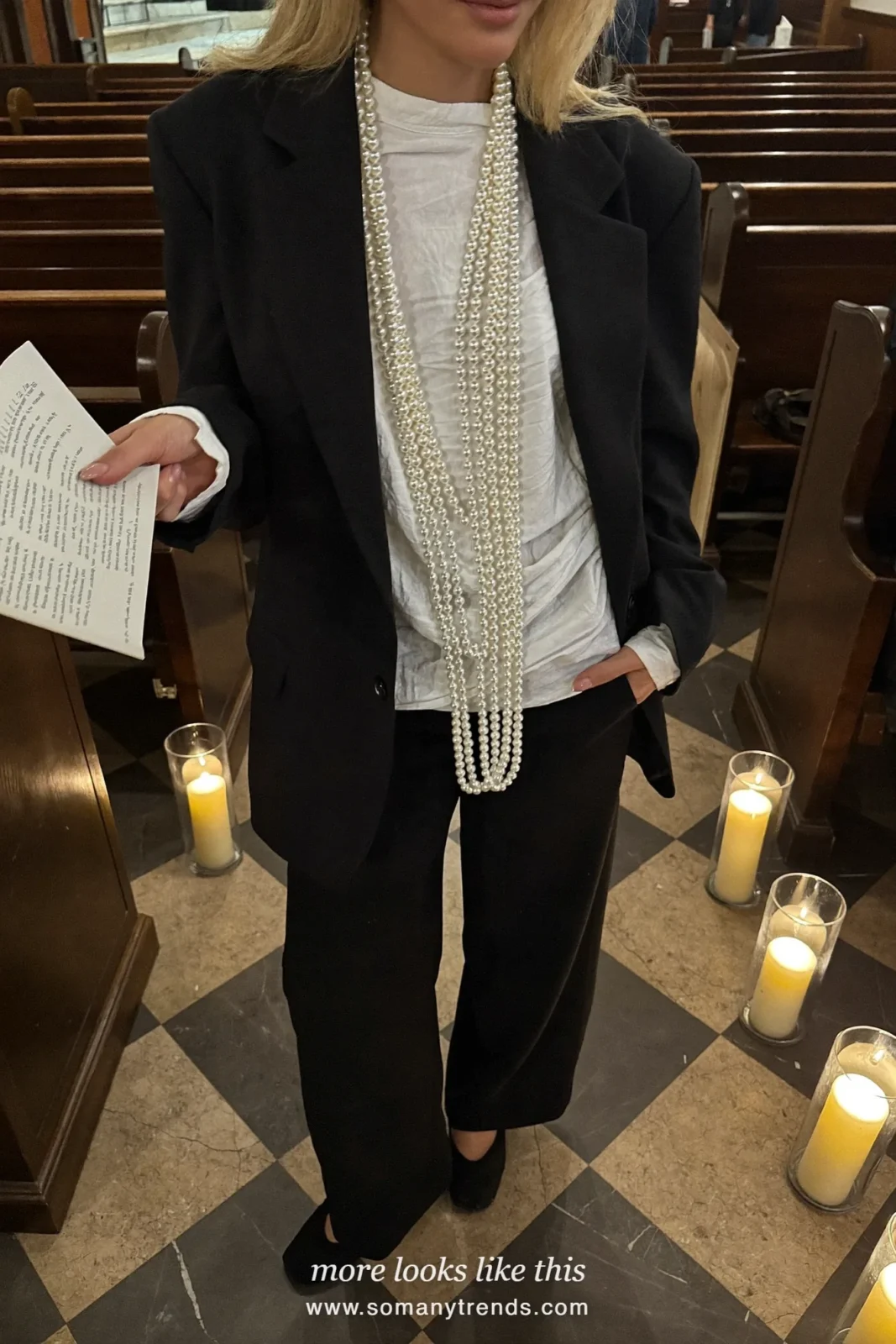 Woman in a black velvet blazer, white blouse, pearl necklace and black wide pants, church outfit 25