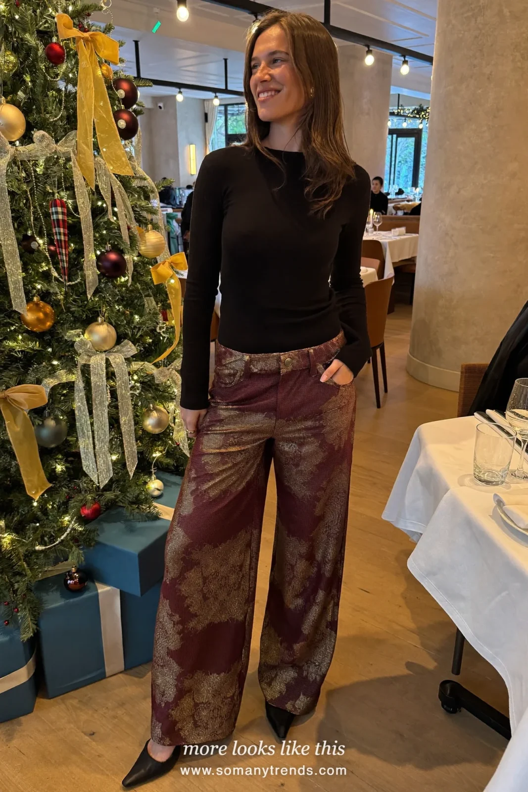 Woman in a black long-sleeve top, burgundy brocade wide-leg pants and black pumps, outfit 31