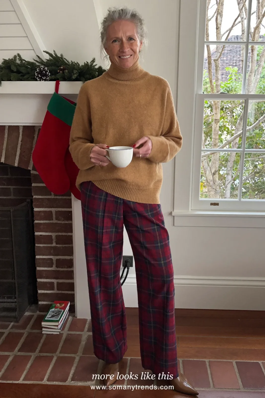 Woman in a camel turtleneck, red and navy plaid wide-leg pants and brown pointed ankle boots at a family Christmas afternoon, outfit 15