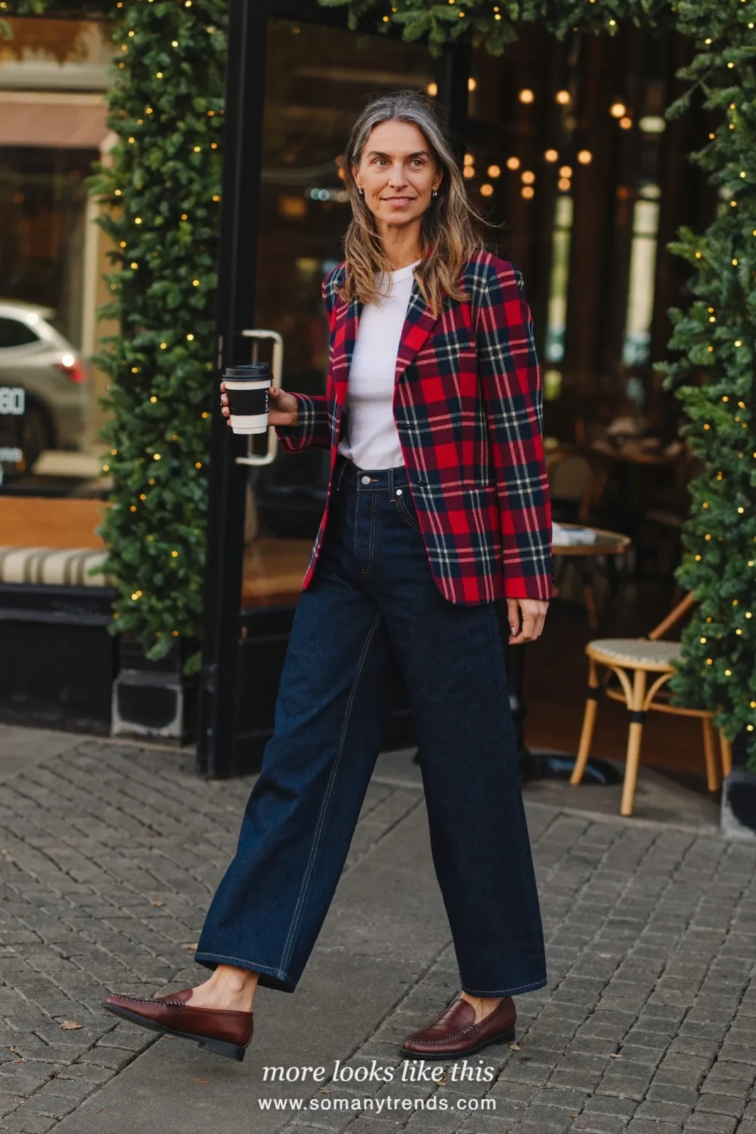 Woman in a red and navy plaid blazer, white tee, straight jeans and loafers at a casual Christmas lunch, outfit 19