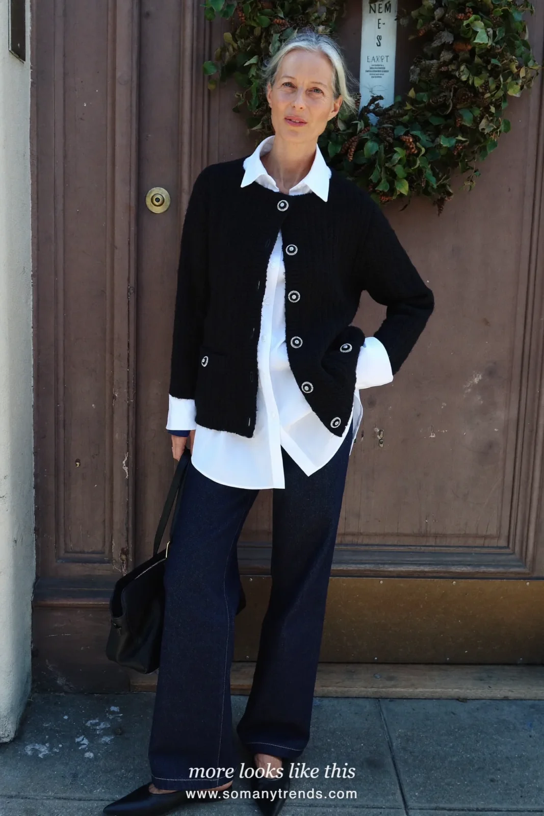 Woman in a black jeweled-button cardigan, white shirt, dark straight jeans and pointed flats at a church service, outfit 22