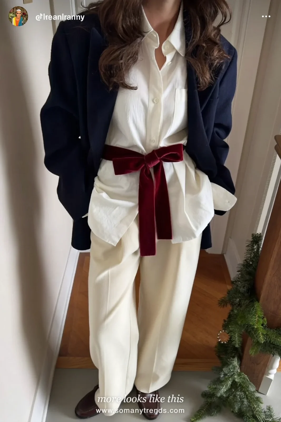 Woman in a navy blazer, white shirt, red velvet ribbon at the waist, cream wide-leg pants and loafers, outfit 3