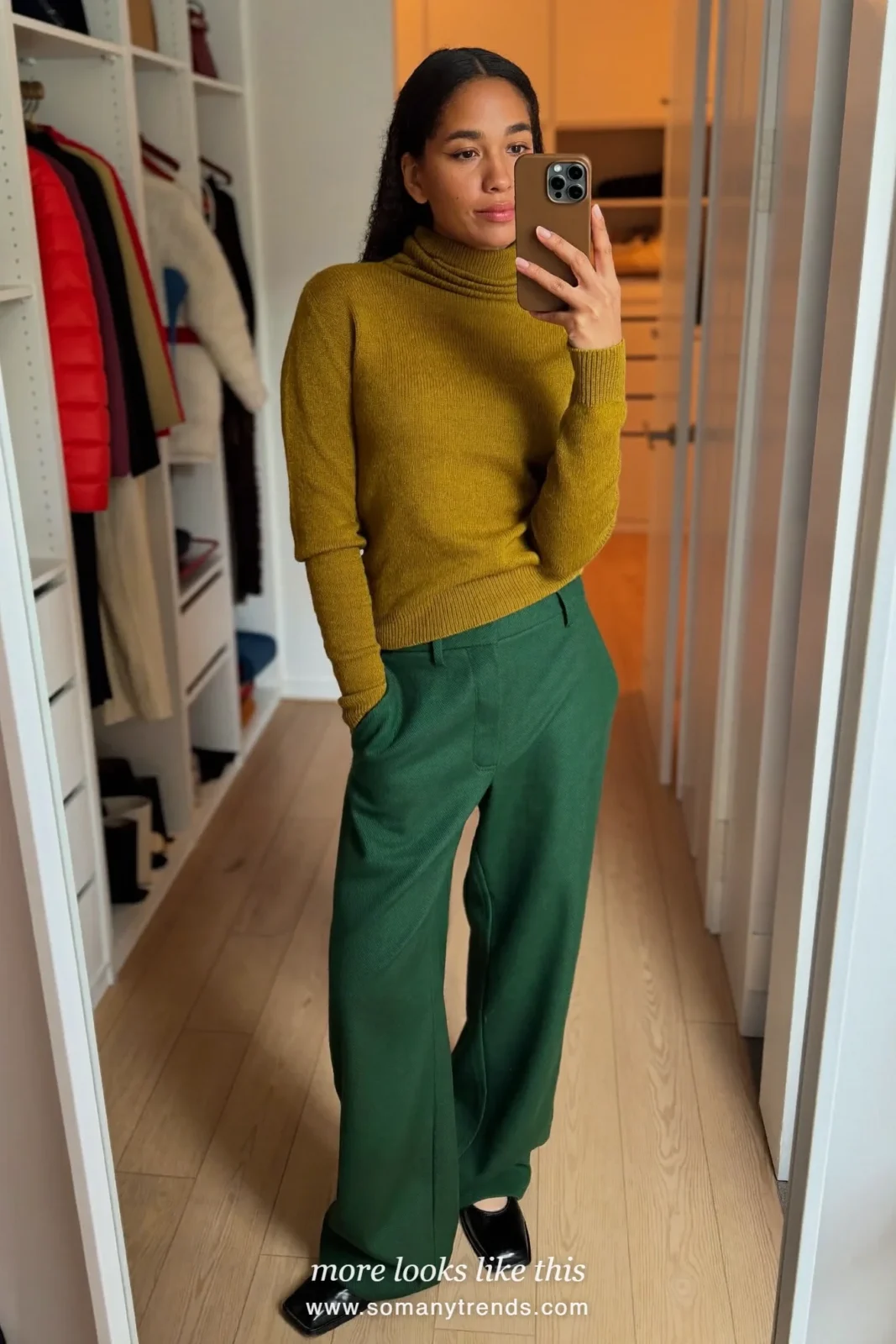 Woman wearing a pine green fine-knit turtleneck, wide-leg pine green pants and black square-toe flats, winter graduation outfit 24
