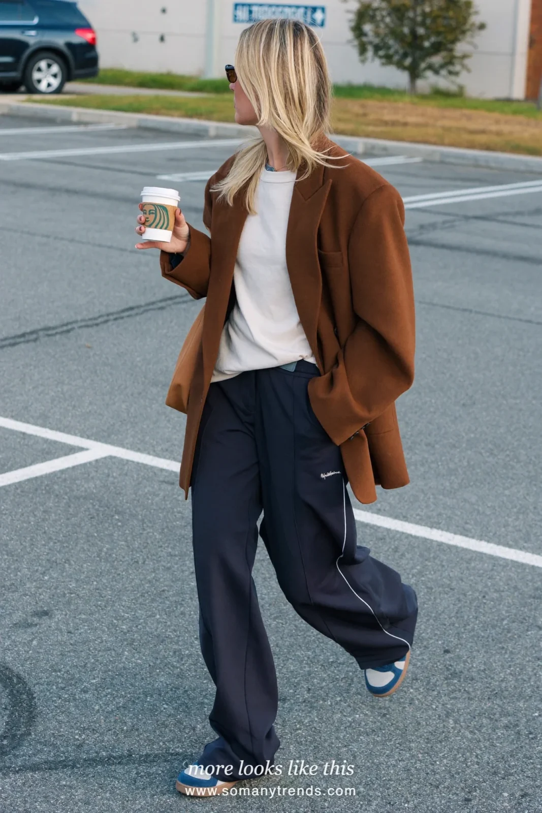 Espresso brown relaxed blazer over an ivory tee with navy straight track pants and gray sneakers, outfit 5