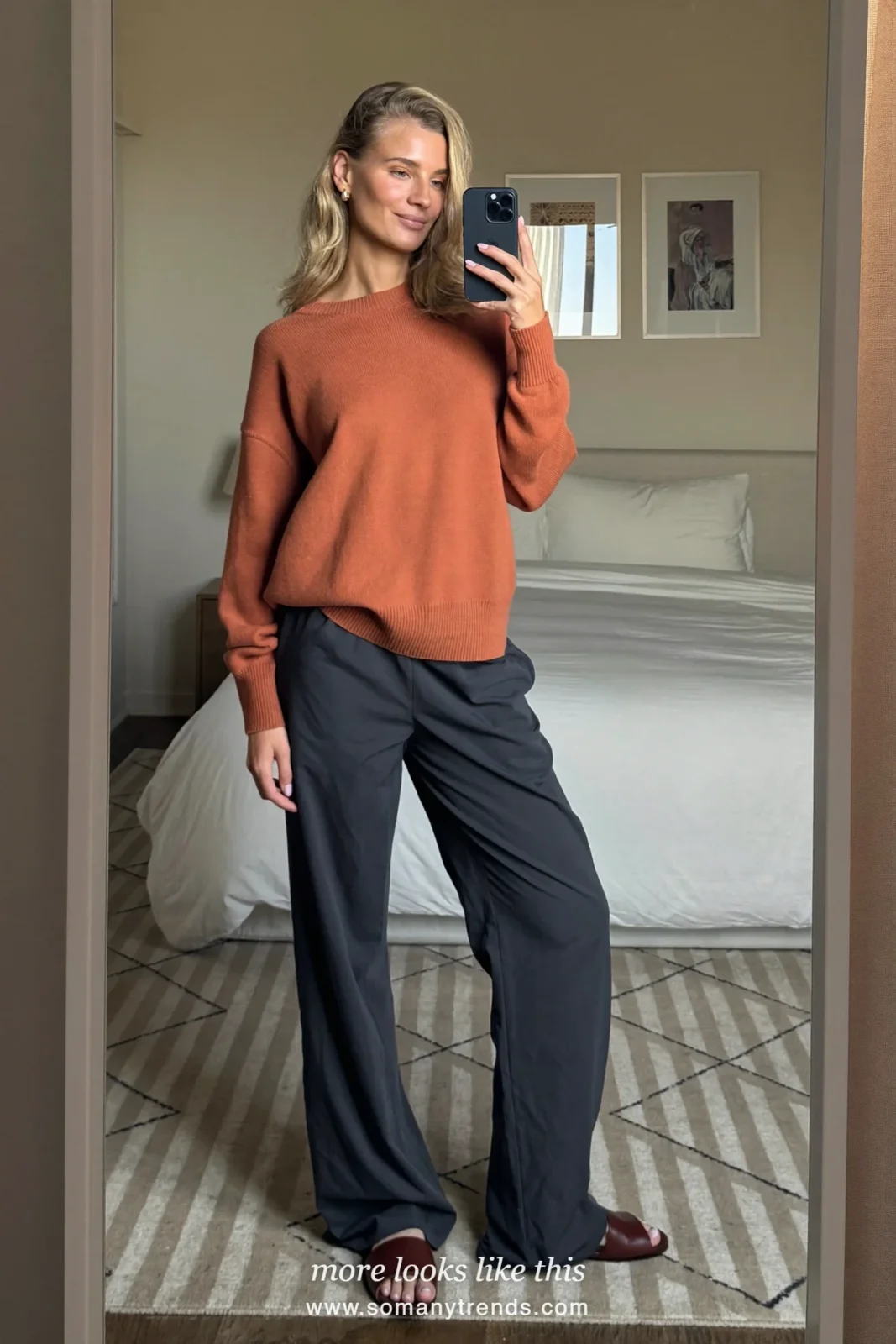 Rust lightweight cotton sweater with soft navy wide-leg crepe pants and brown leather slides, outfit 8