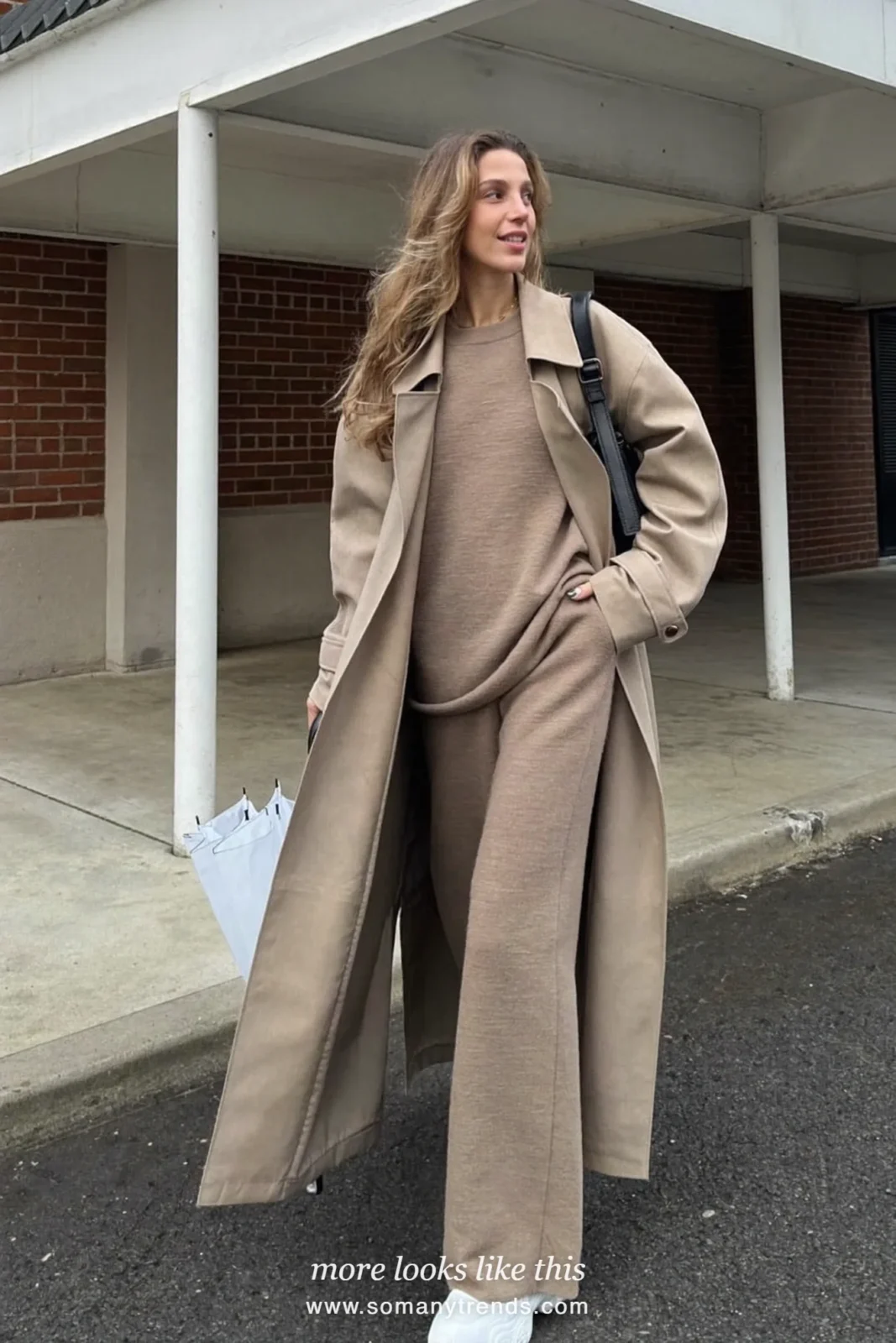 Stone lightweight trench coat over an oatmeal knit top and wide-leg knit pants with white sneakers, outfit 19