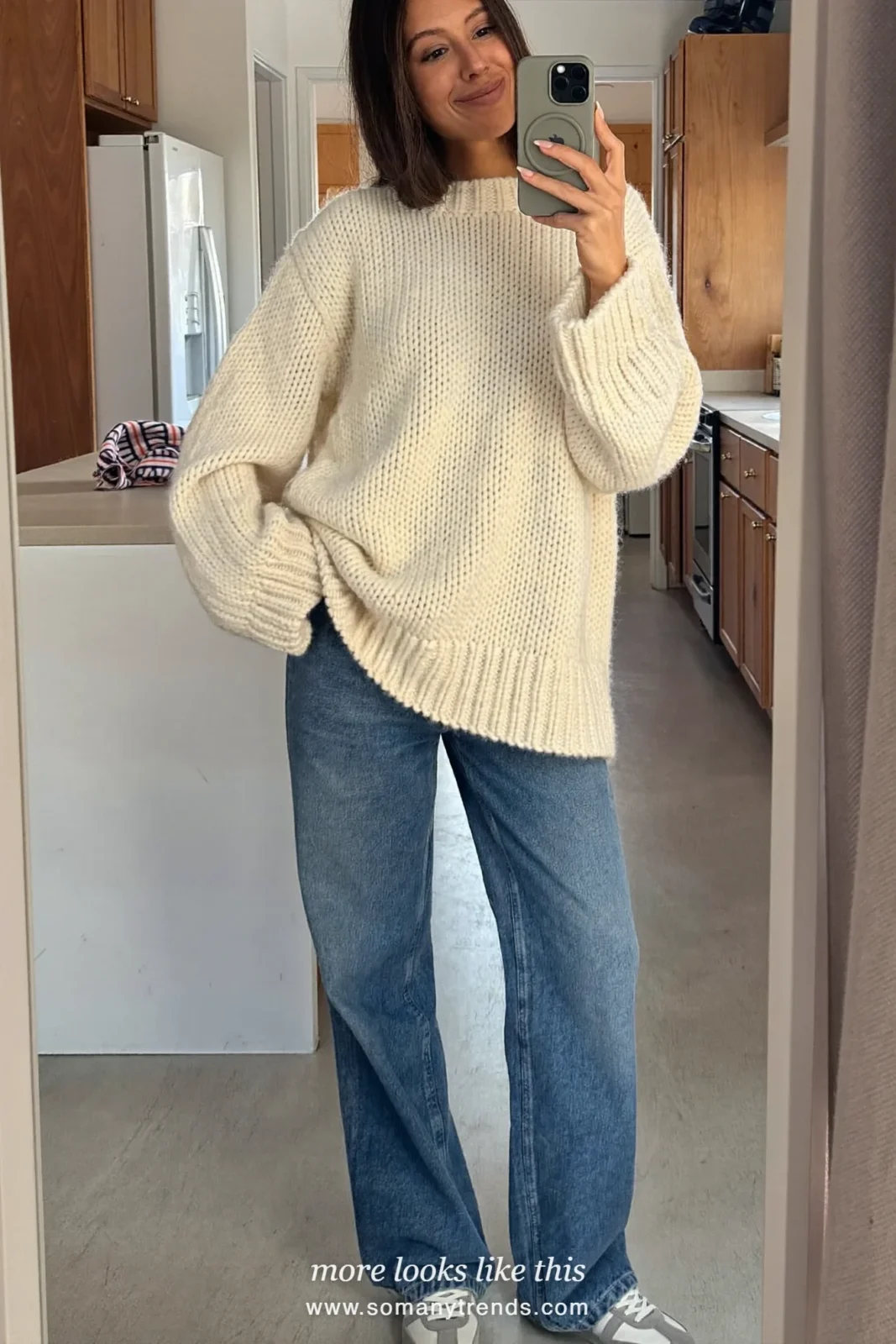 Ivory cotton fisherman sweater with washed blue wide-leg jeans and gray sneakers, outfit 20