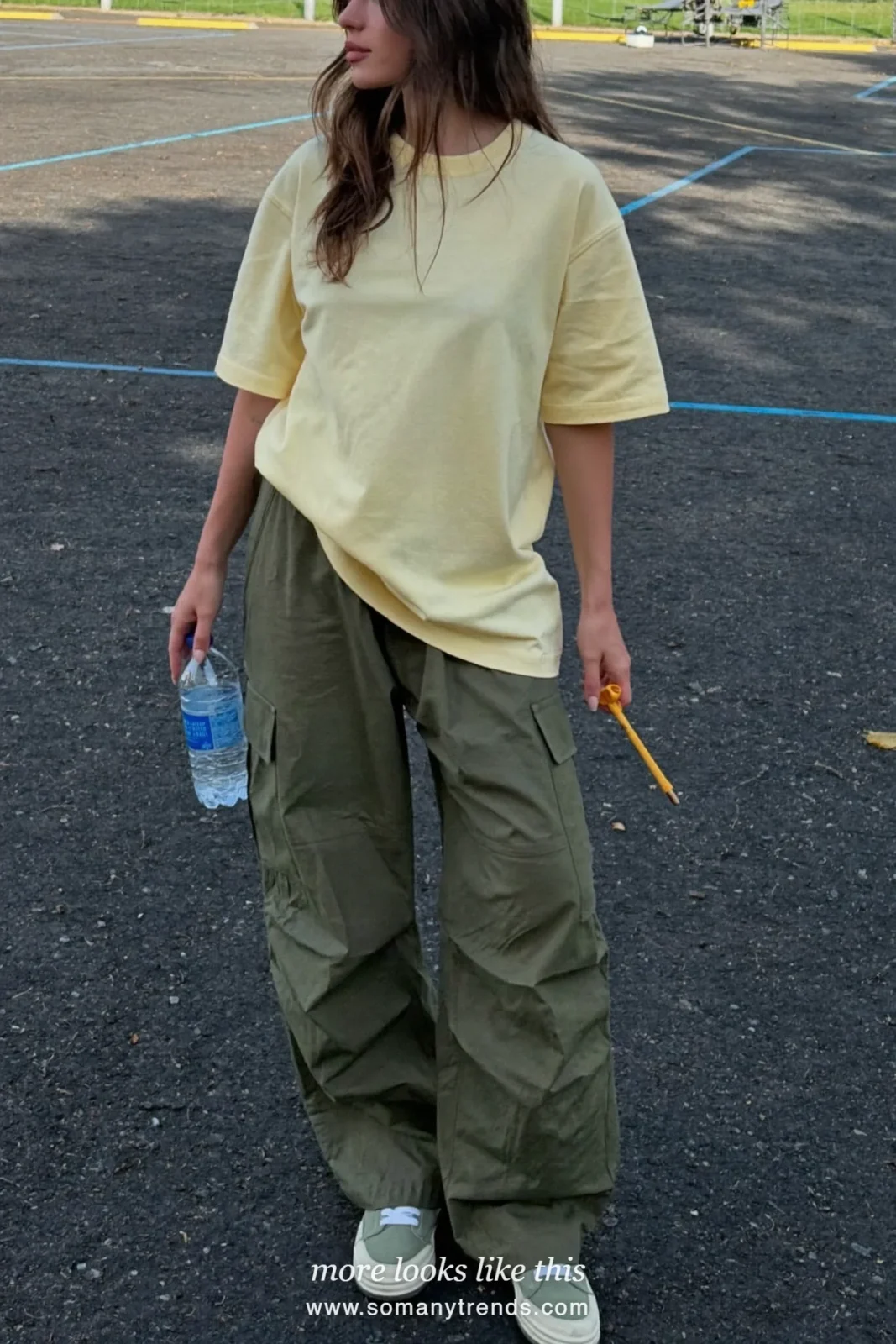 Butter yellow cotton tee with olive relaxed cargo pants and gray sneakers, outfit 9