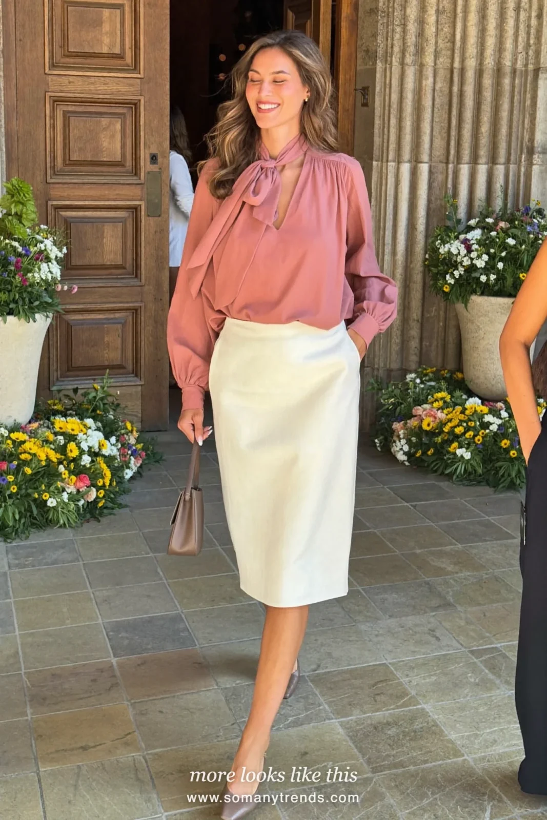 Woman in a dusty rose bow-neck blouse, ivory straight skirt and taupe pumps, spring church outfit 10