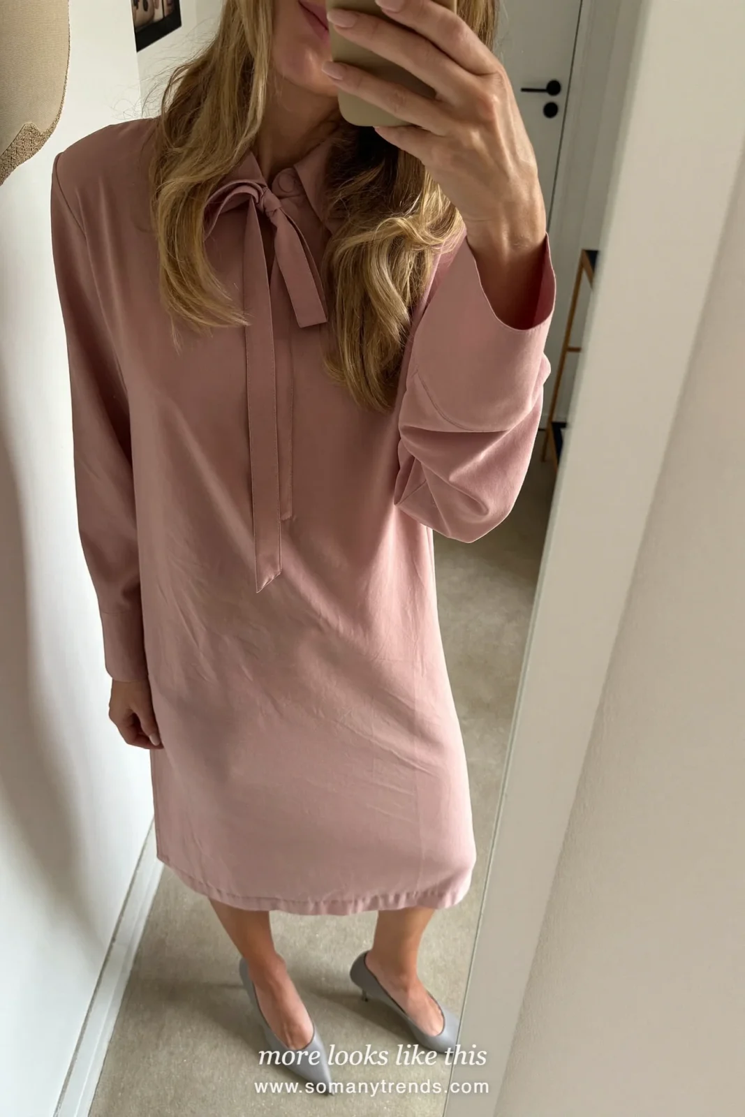 Woman in a dusty rose midi dress with a bow neckline and soft gray pumps, spring church outfit 16
