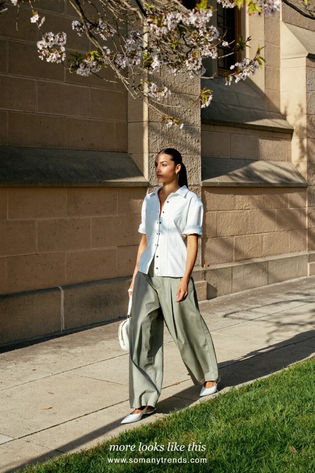 Woman in a white shirt, wide sage green pants, silver barrette and white flats, spring church outfit 21