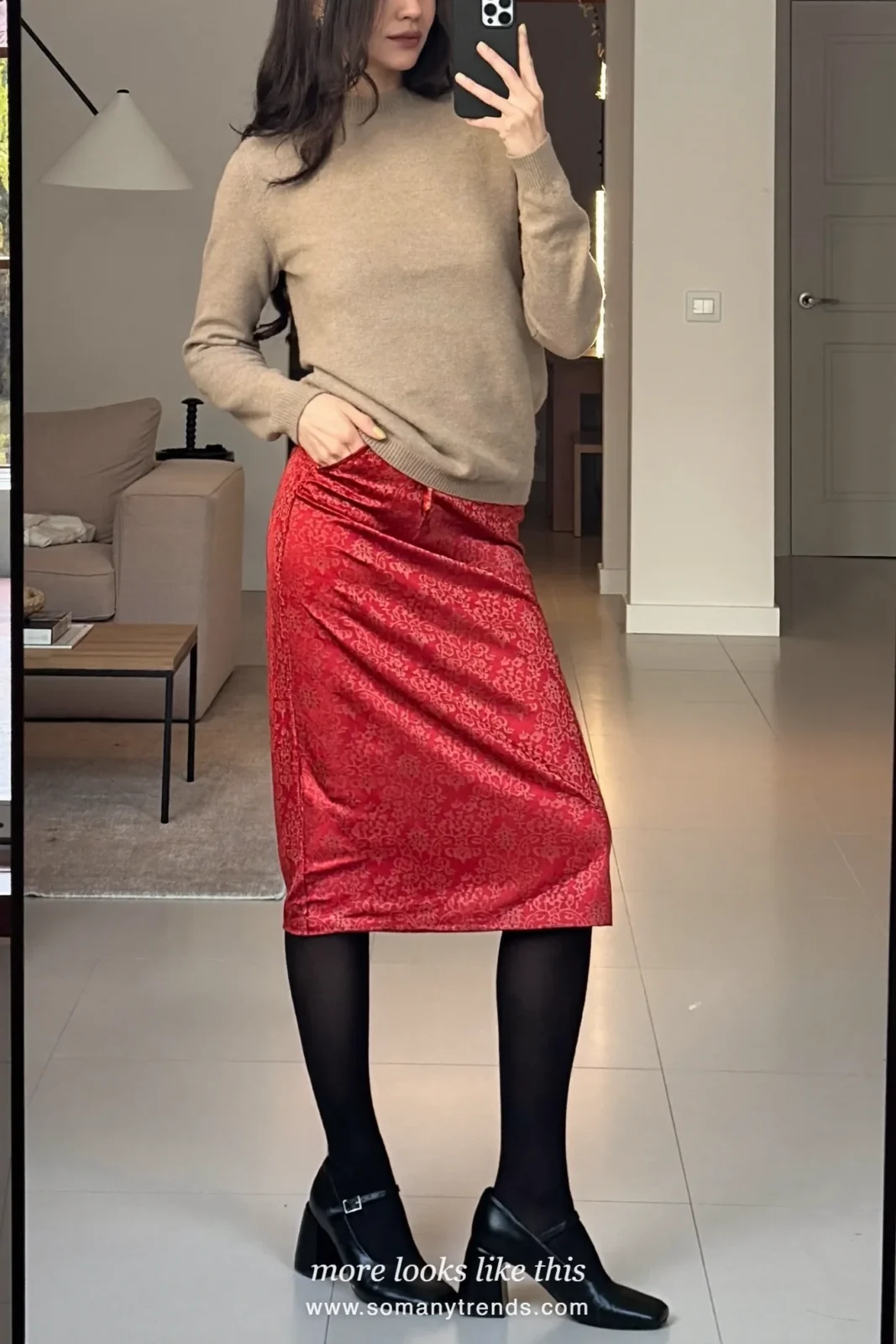 Woman wearing an oatmeal fine-knit crewneck, red brocade midi skirt, black tights and black low-heel Mary Janes, winter graduation outfit 12