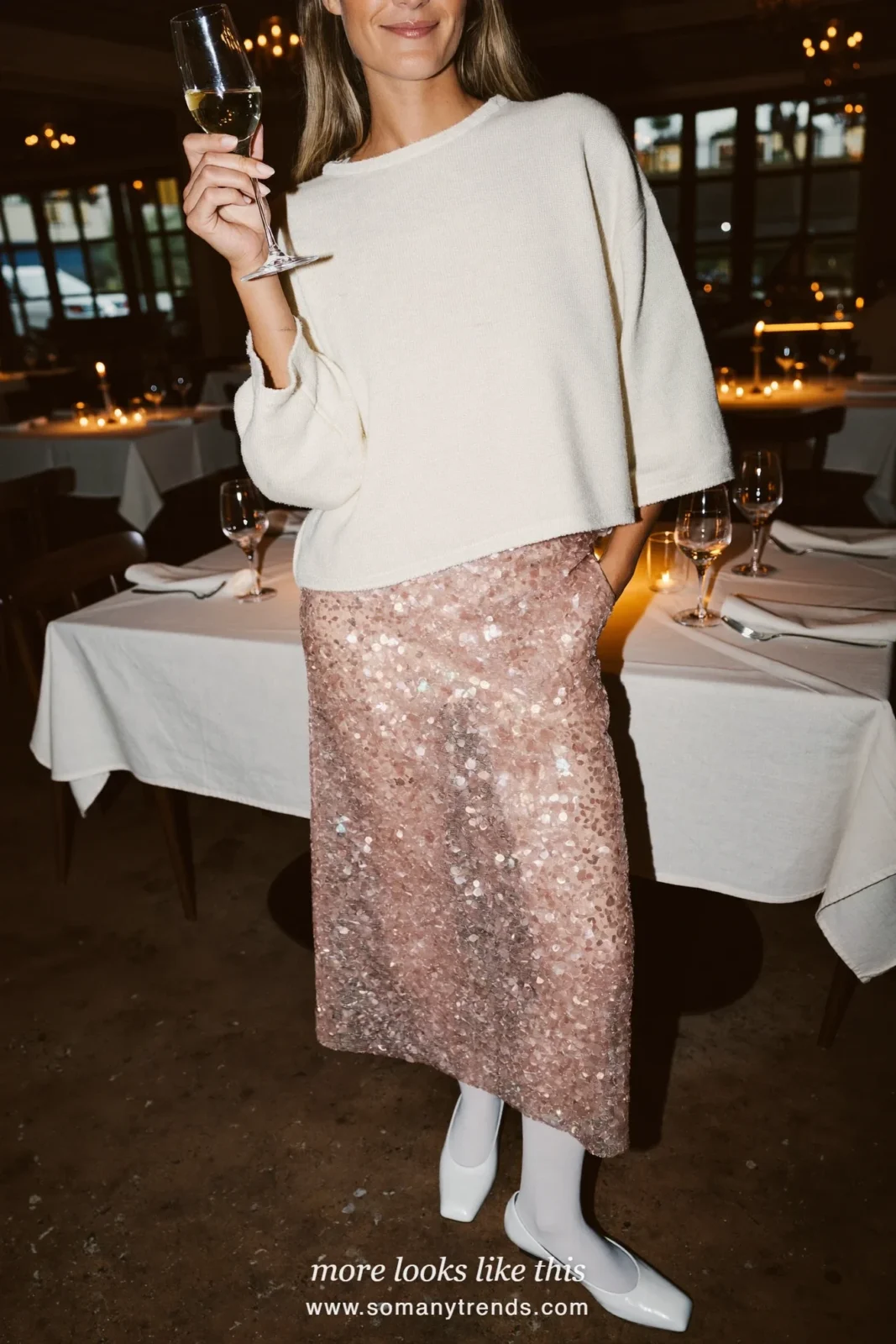 Woman in a white fine knit sweater, blush sequin midi skirt and white pumps, outfit 10