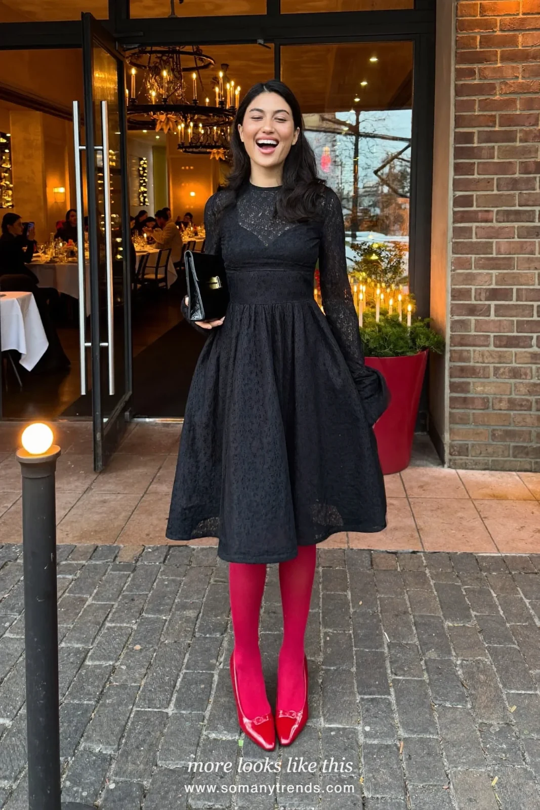 Woman in a black lace long-sleeve midi dress, sheer black tights and cherry red pumps, outfit 15