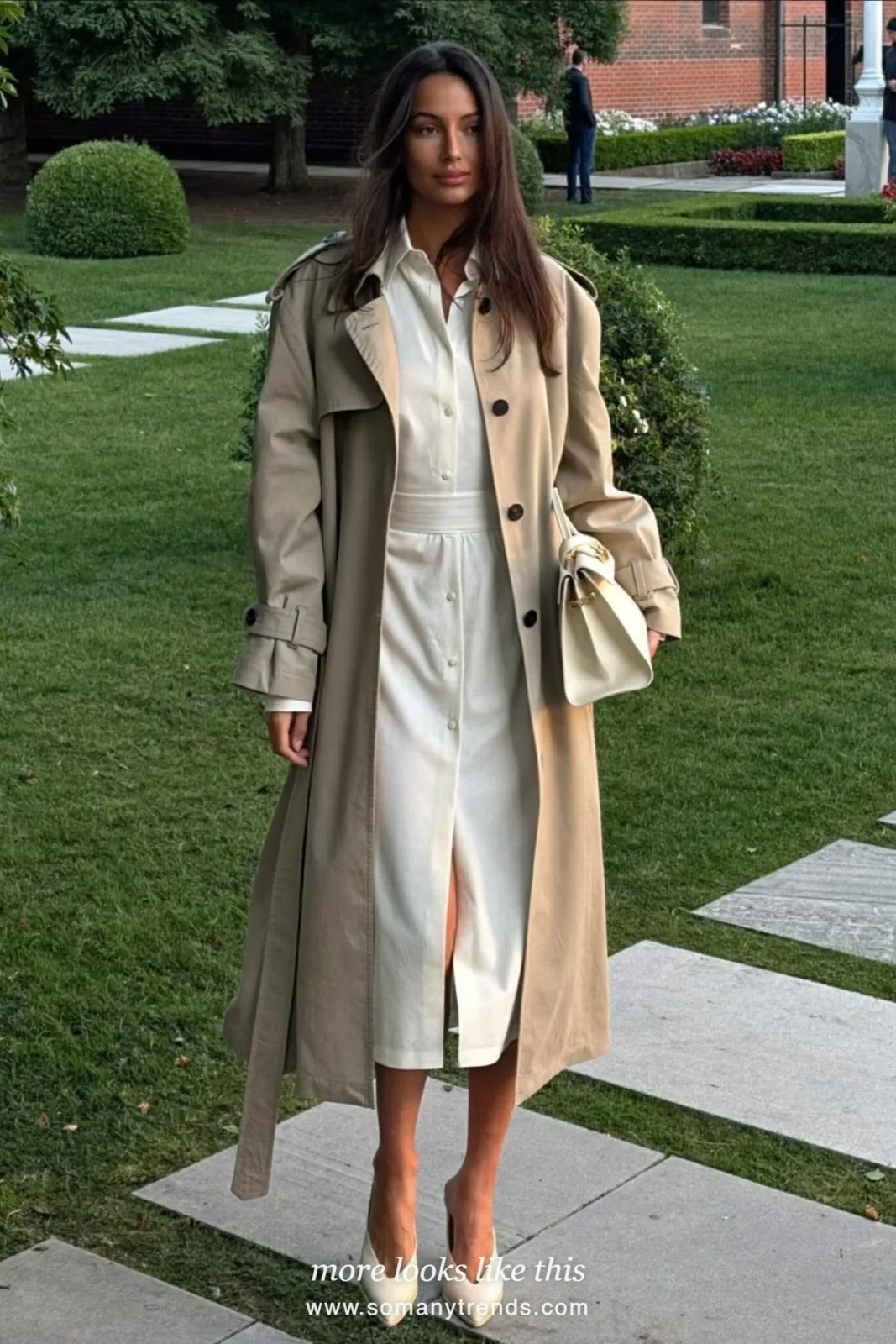 Woman in an ivory shirt dress under a stone trench coat with cream pumps, spring church outfit 15