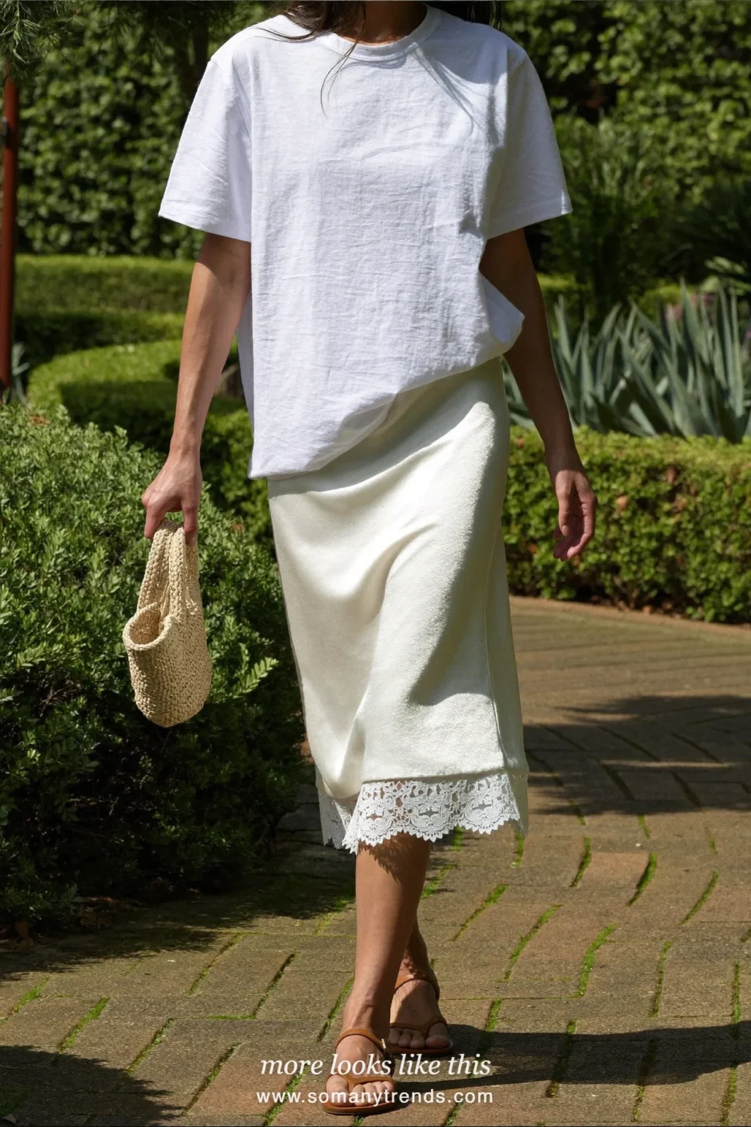 Look 7: white oversized tee, ivory lace-trimmed slip skirt and tan flat sandals
