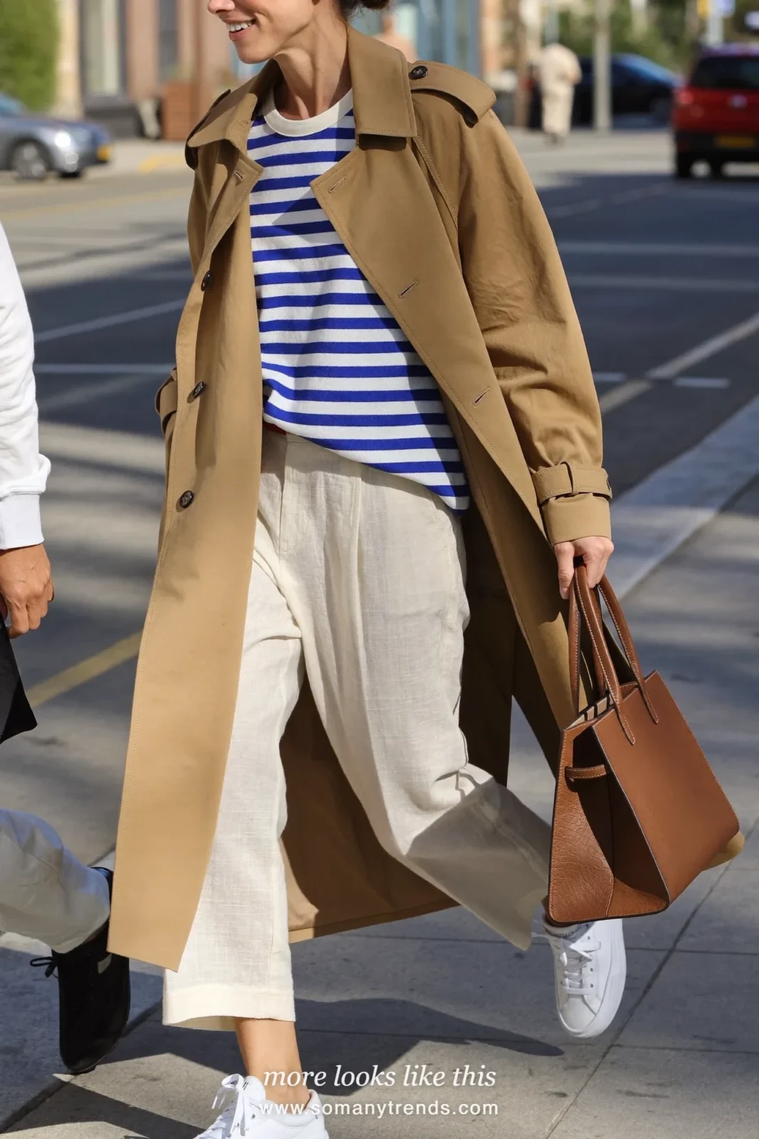 Look 21: tan lightweight trench coat, striped tee, ivory linen pants and white canvas sneakers