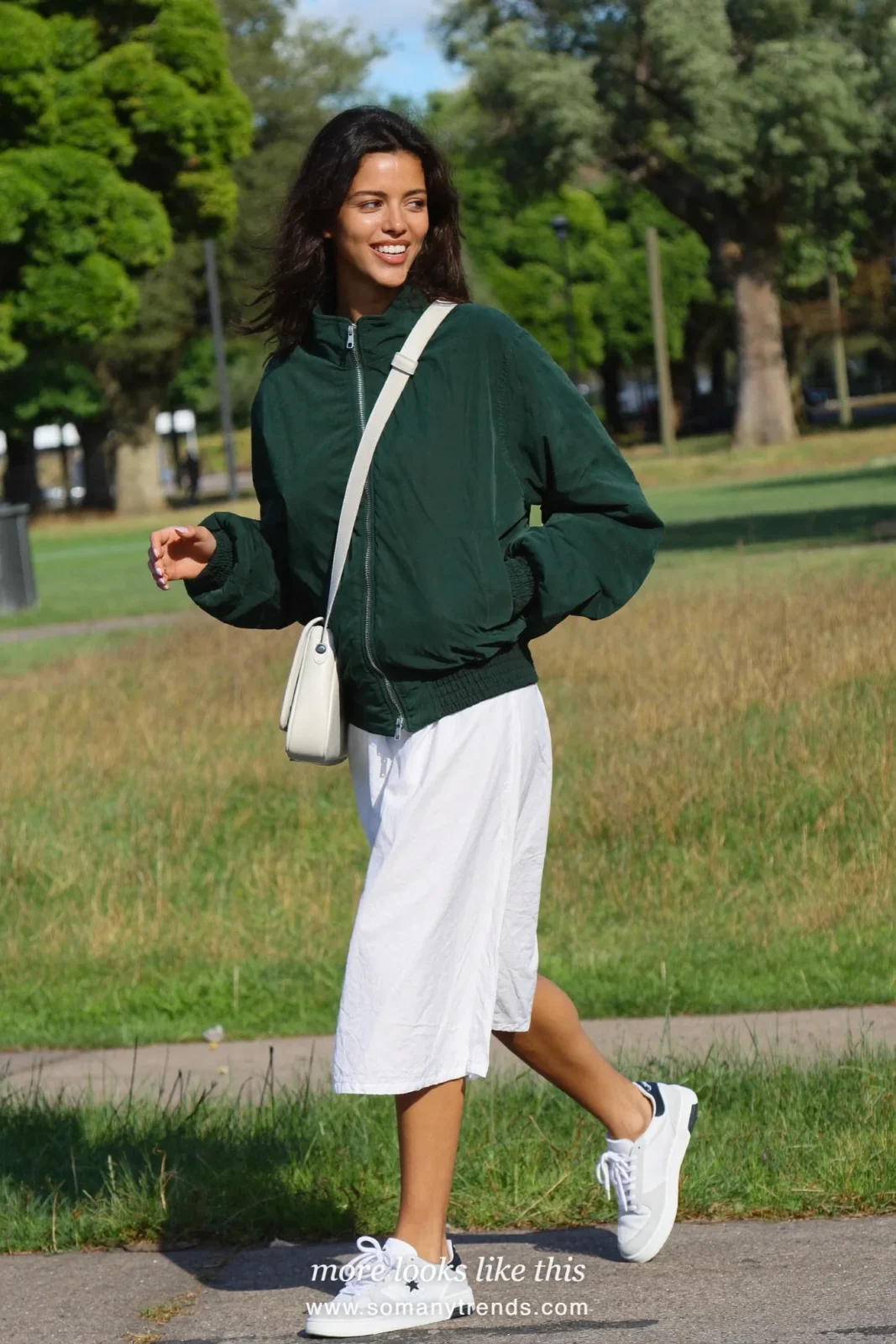 Look 26: forest green lightweight bomber, white cotton midi dress and white sneakers