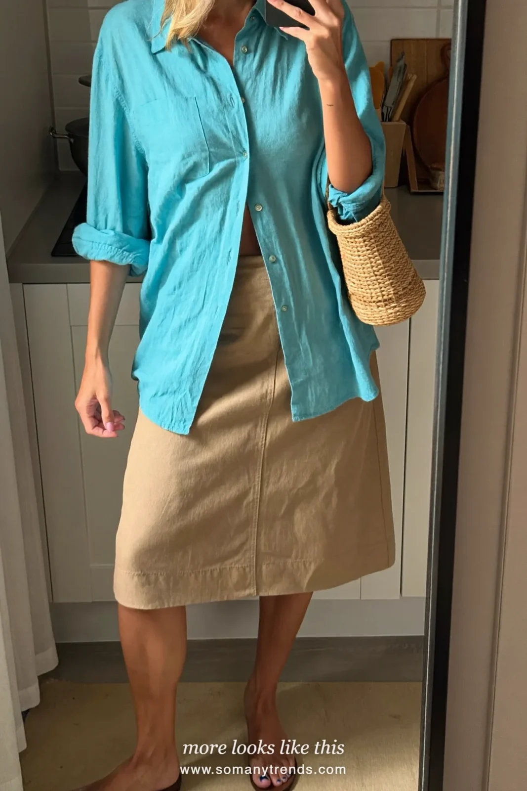 Look 32: aquamarine linen shirt, tan knee-length skirt and brown flat sandals, mirror selfie at home