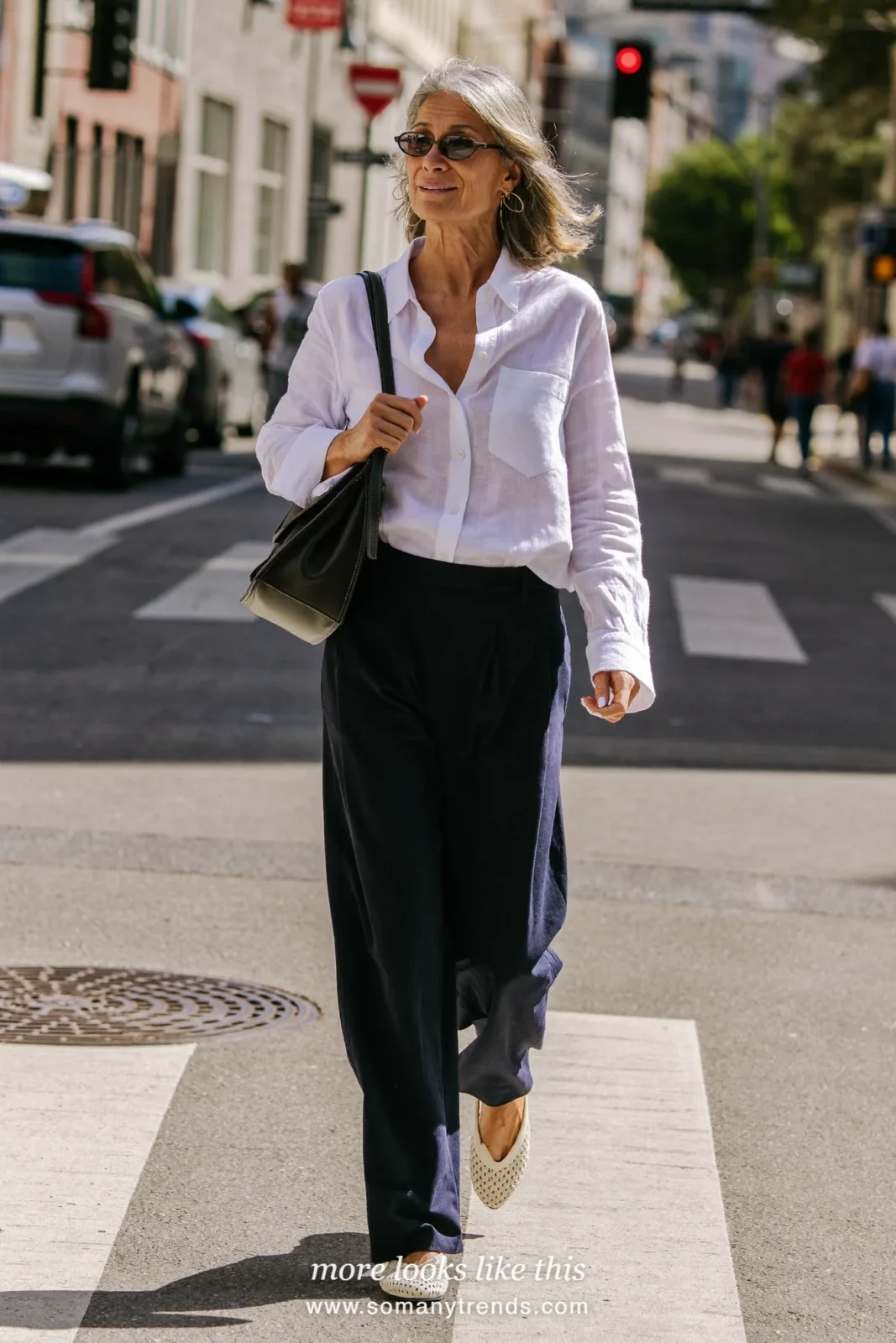 Woman in her forties wearing white linen-blend shirt, navy wide-leg crepe pants and cream perforated ballet flats, outfit 6