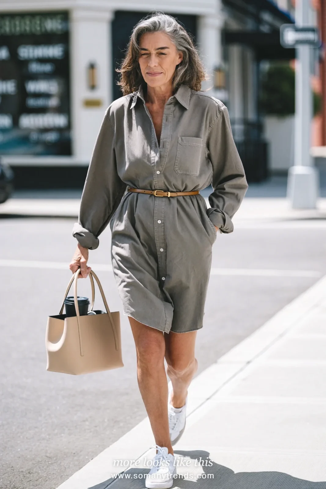 Woman over 50 in a gray belted shirt dress with rolled sleeves and white sneakers, outfit 14