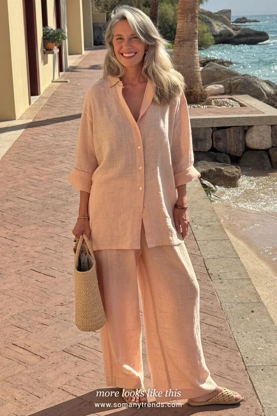 Woman over 50 in a peach linen shirt and matching linen straight pants with flat woven sandals, outfit 15